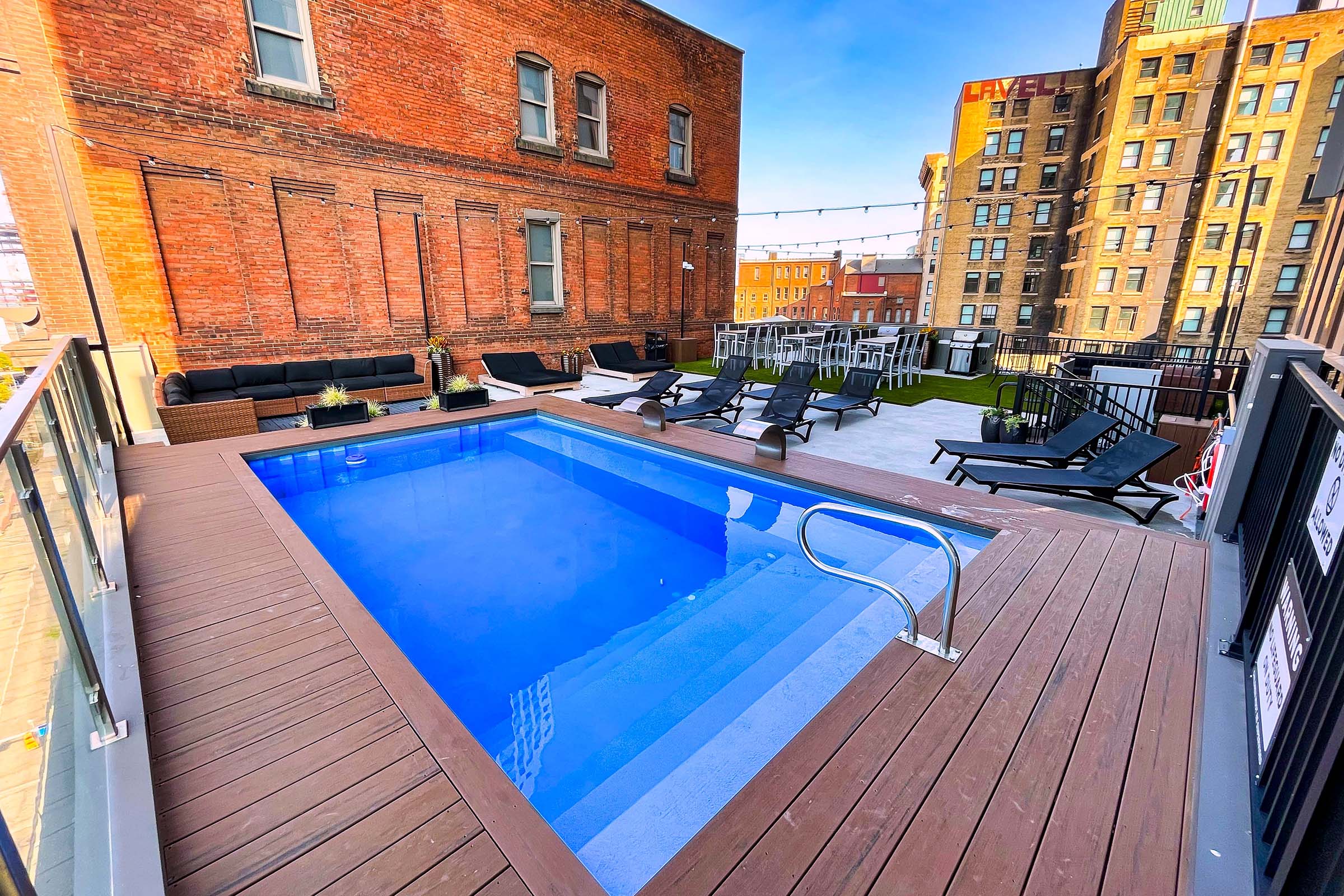 a pool next to a brick building