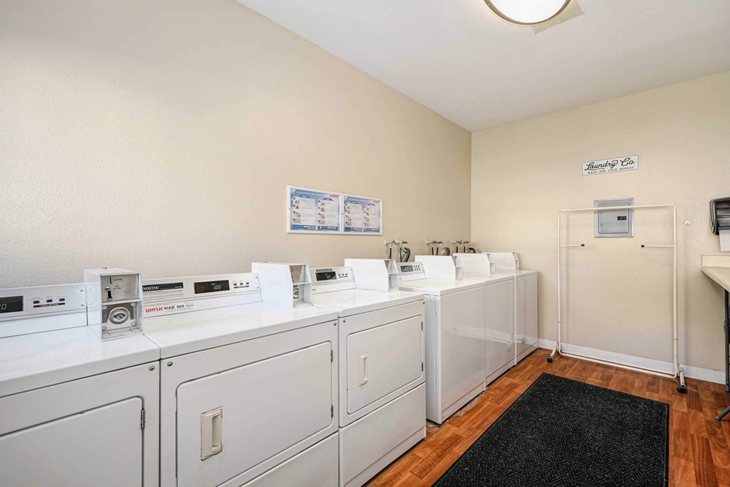 washers and dryers in a laundry room