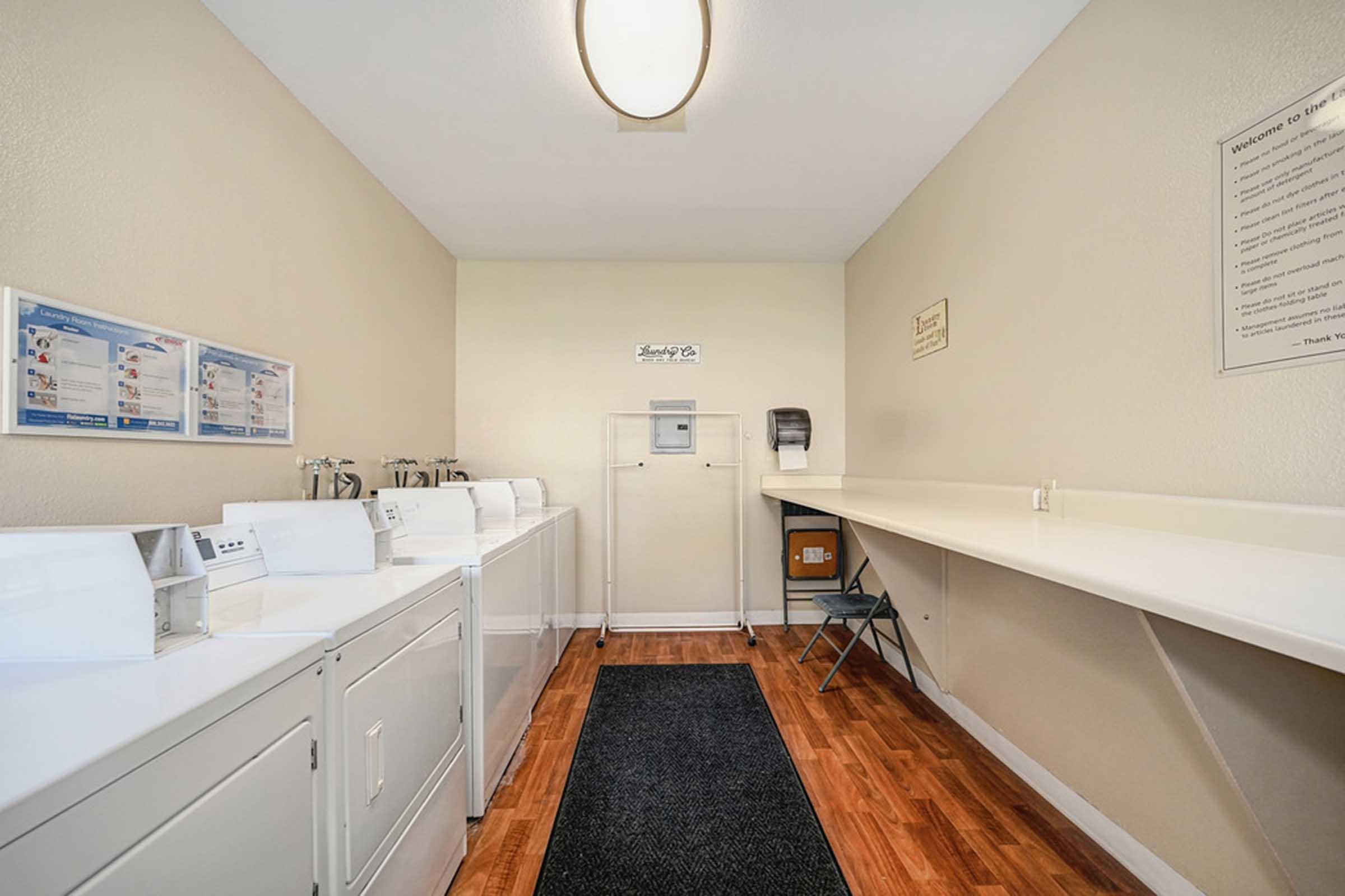 a shelf next to laundry machines