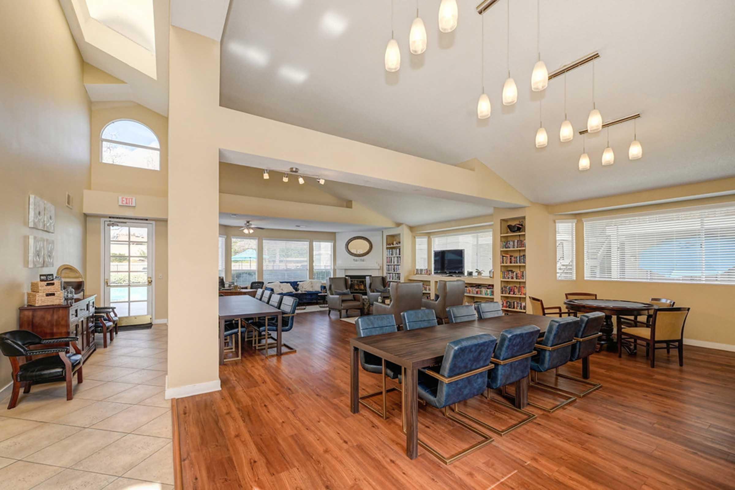 a room filled with furniture and a hard wood floor