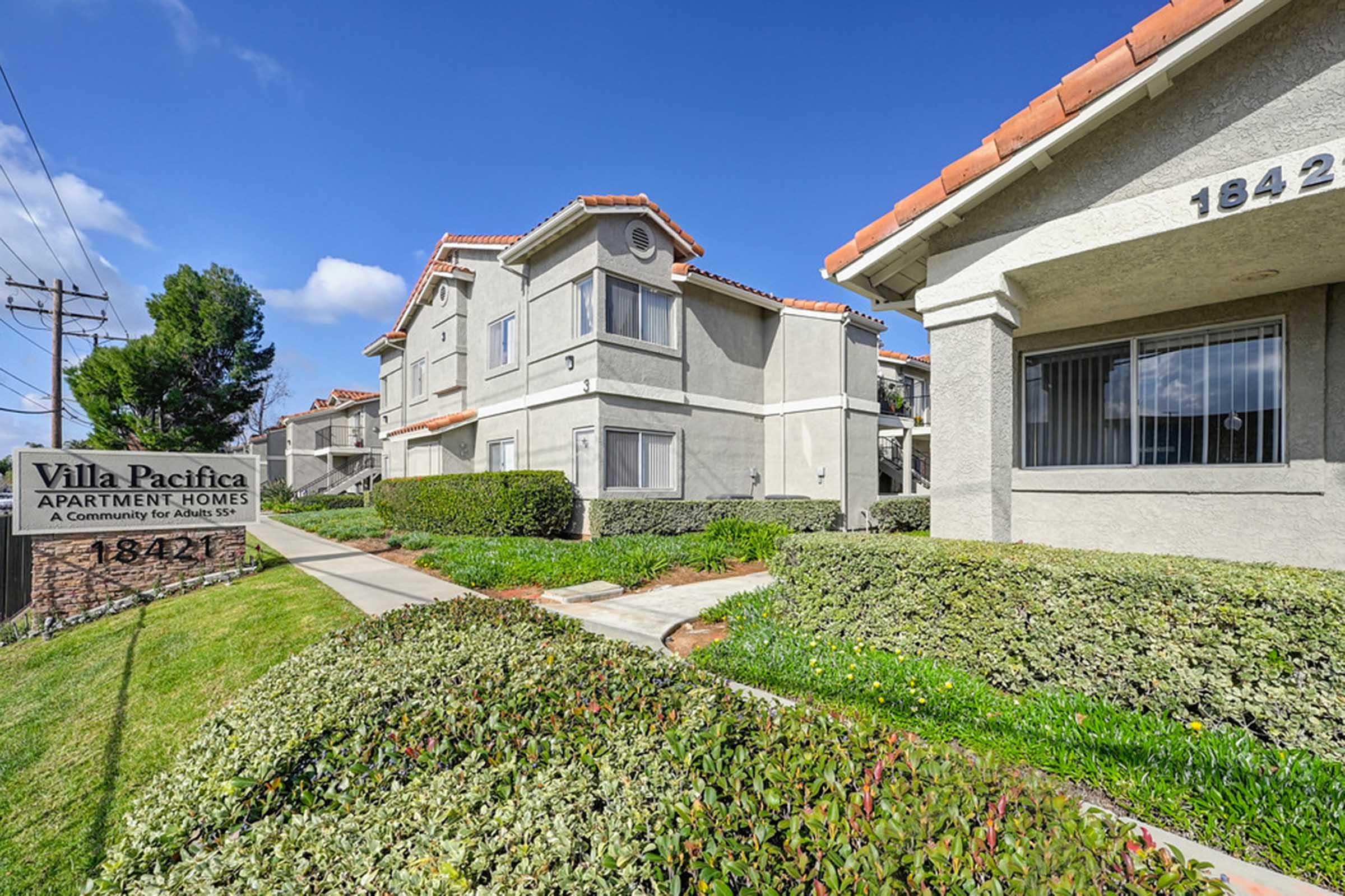 bushes in front of apartment buildings