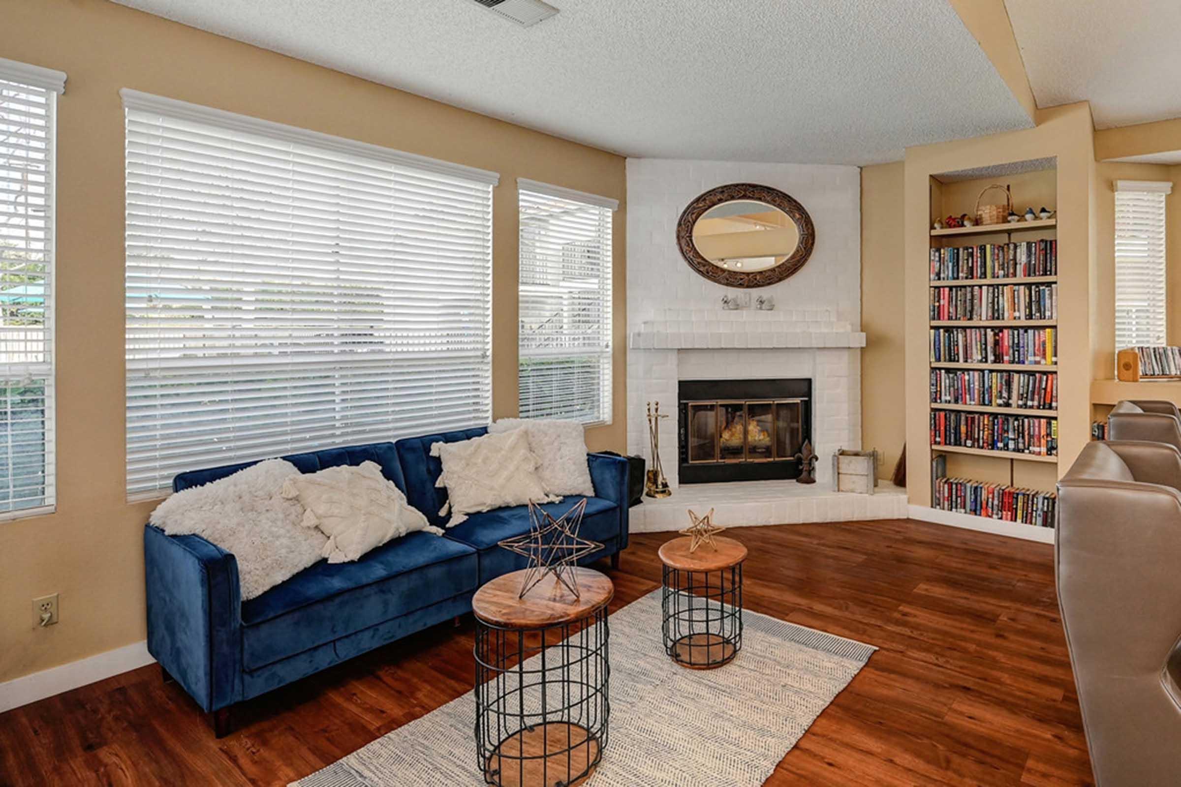 a room with a bookshelf and a fireplace