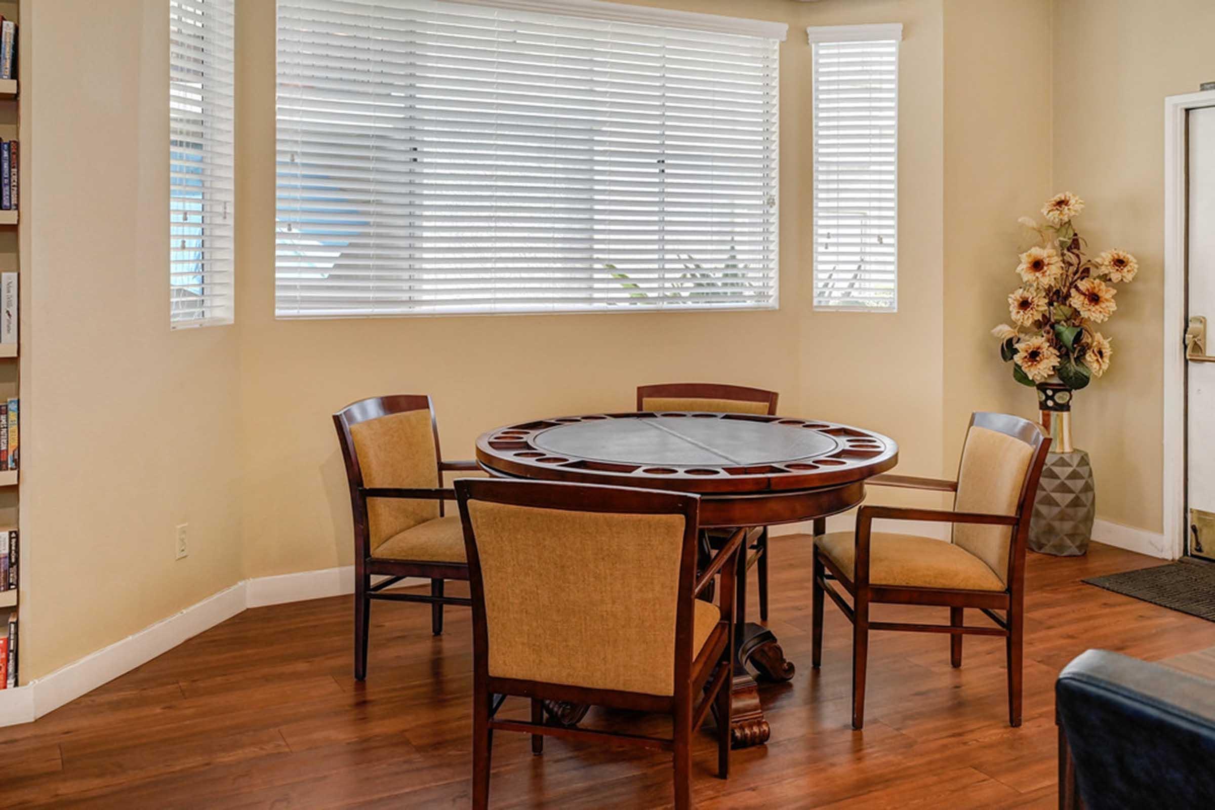 a poker table in front of a window