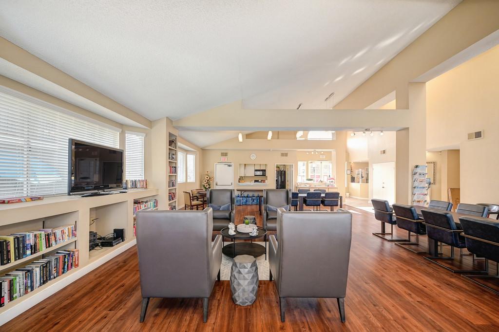 a room filled with furniture and vaulted ceilings