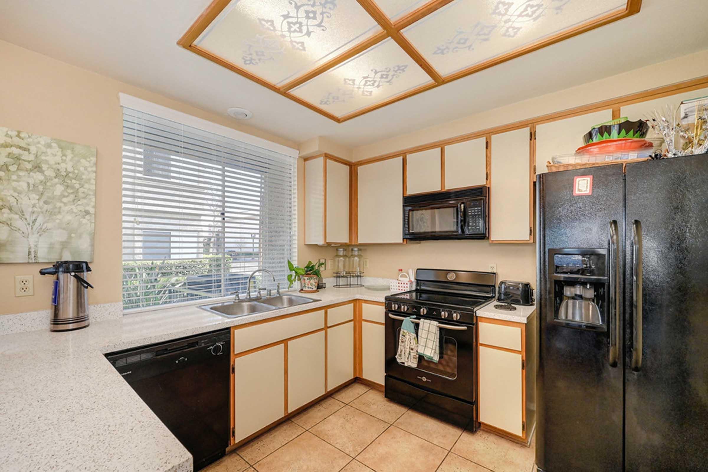 a kitchen with a sink and a window