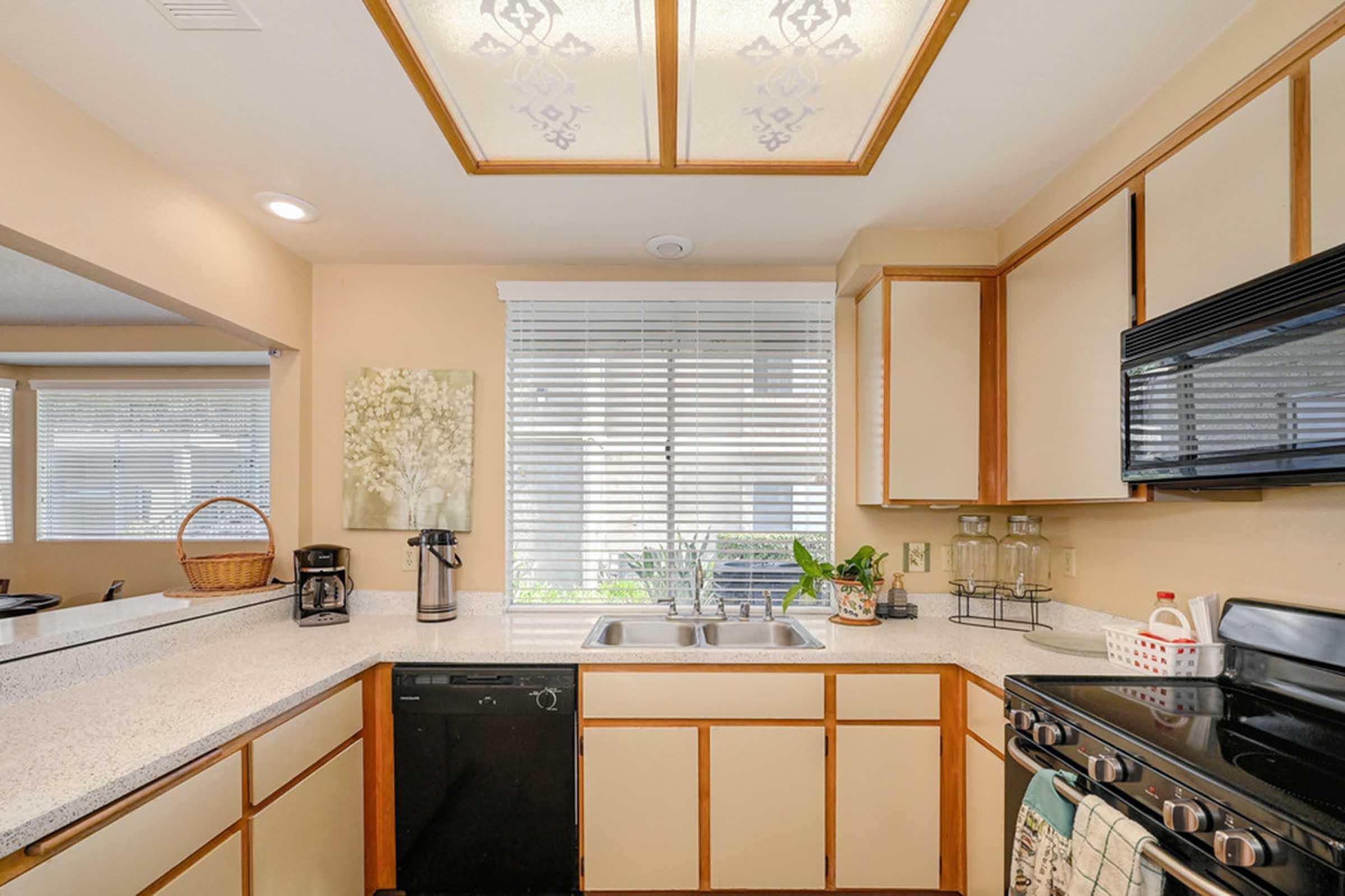 a kitchen with a sink and a dishwasher