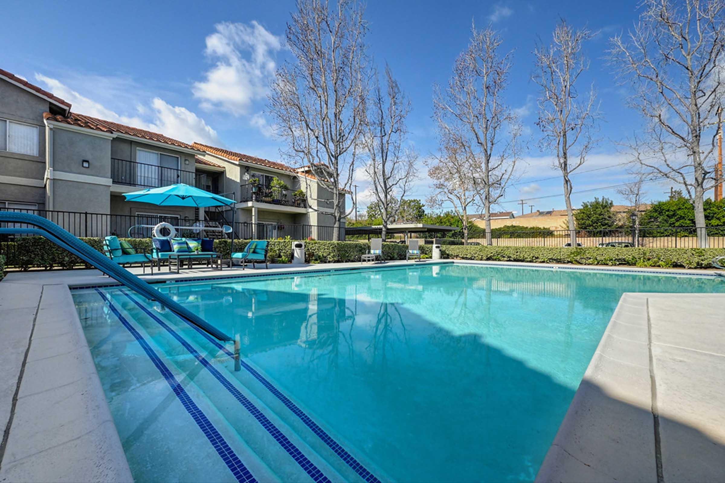 a close up of a pool next to a building