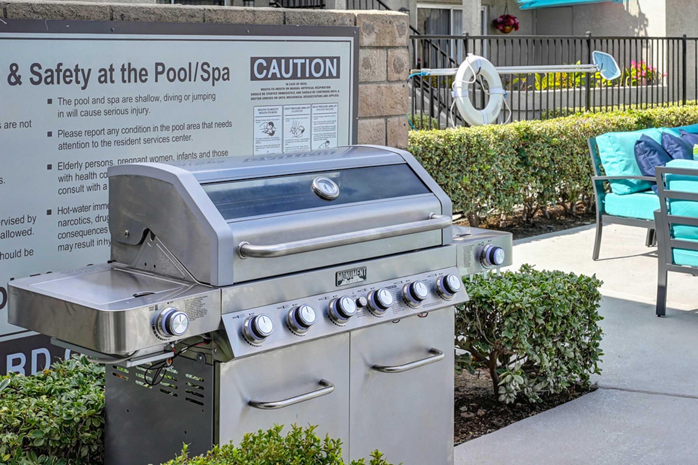 a barbecue in front of a sign