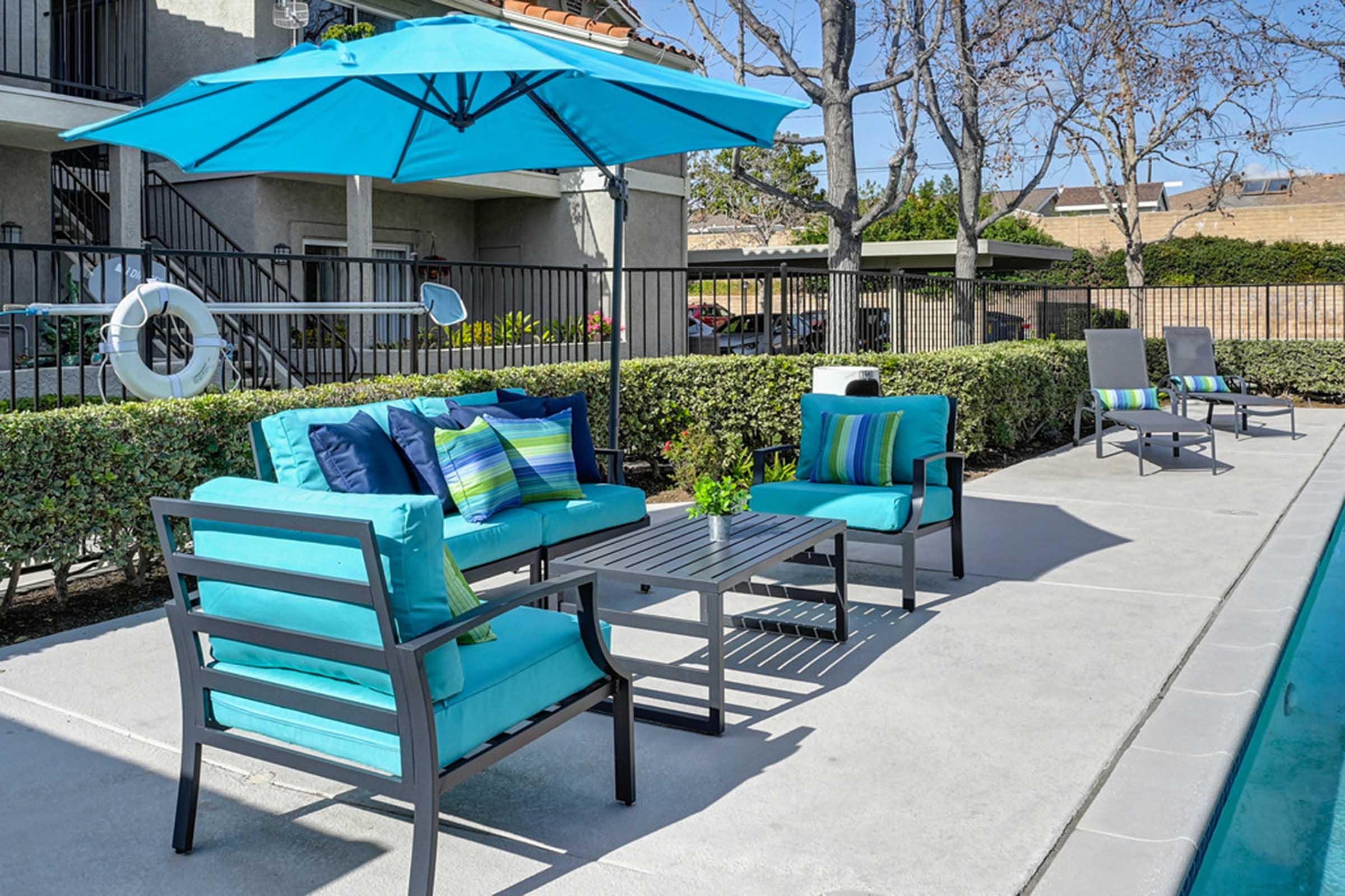 a couple of lounge chairs next to a pool