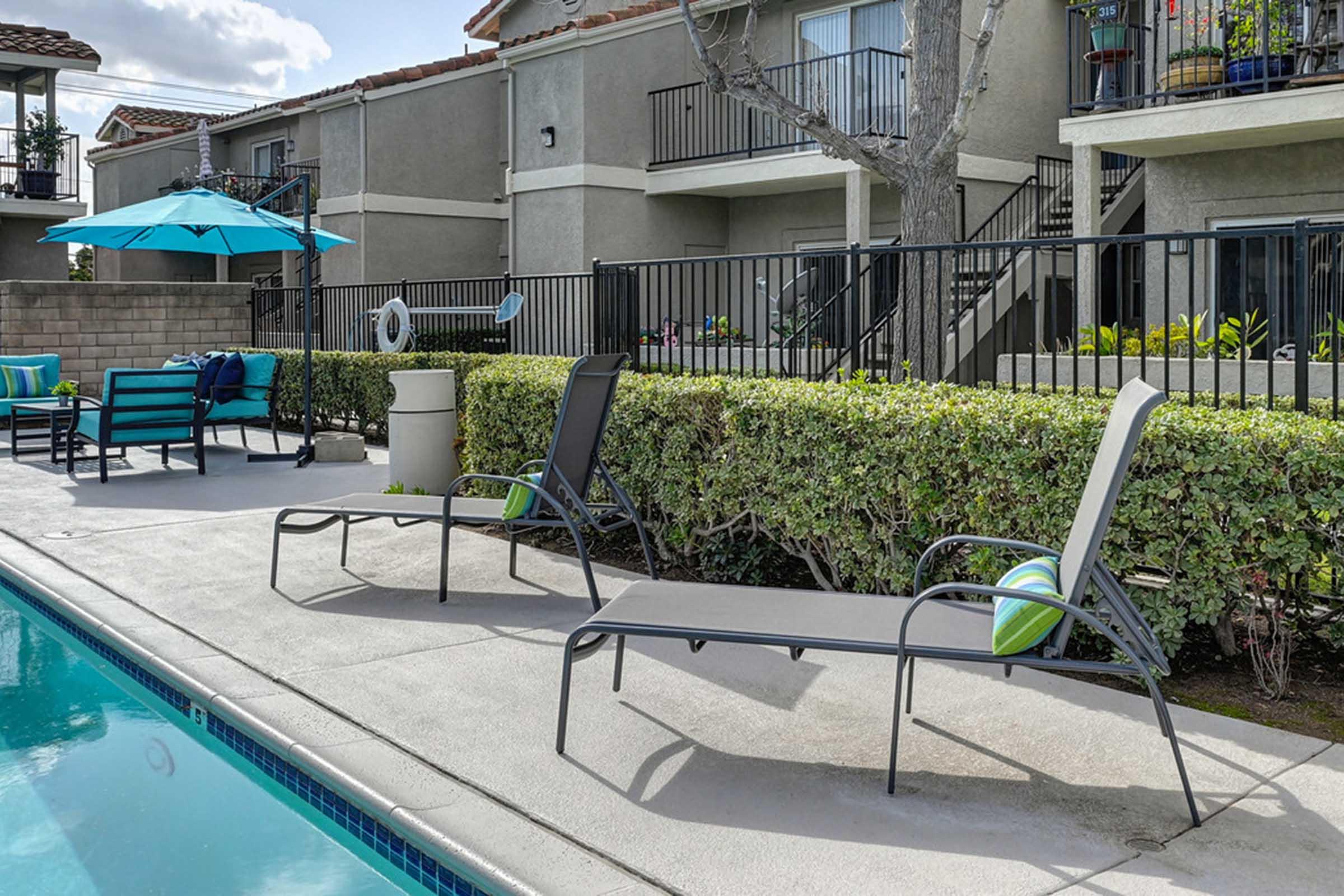 lounge chairs with a building in the background