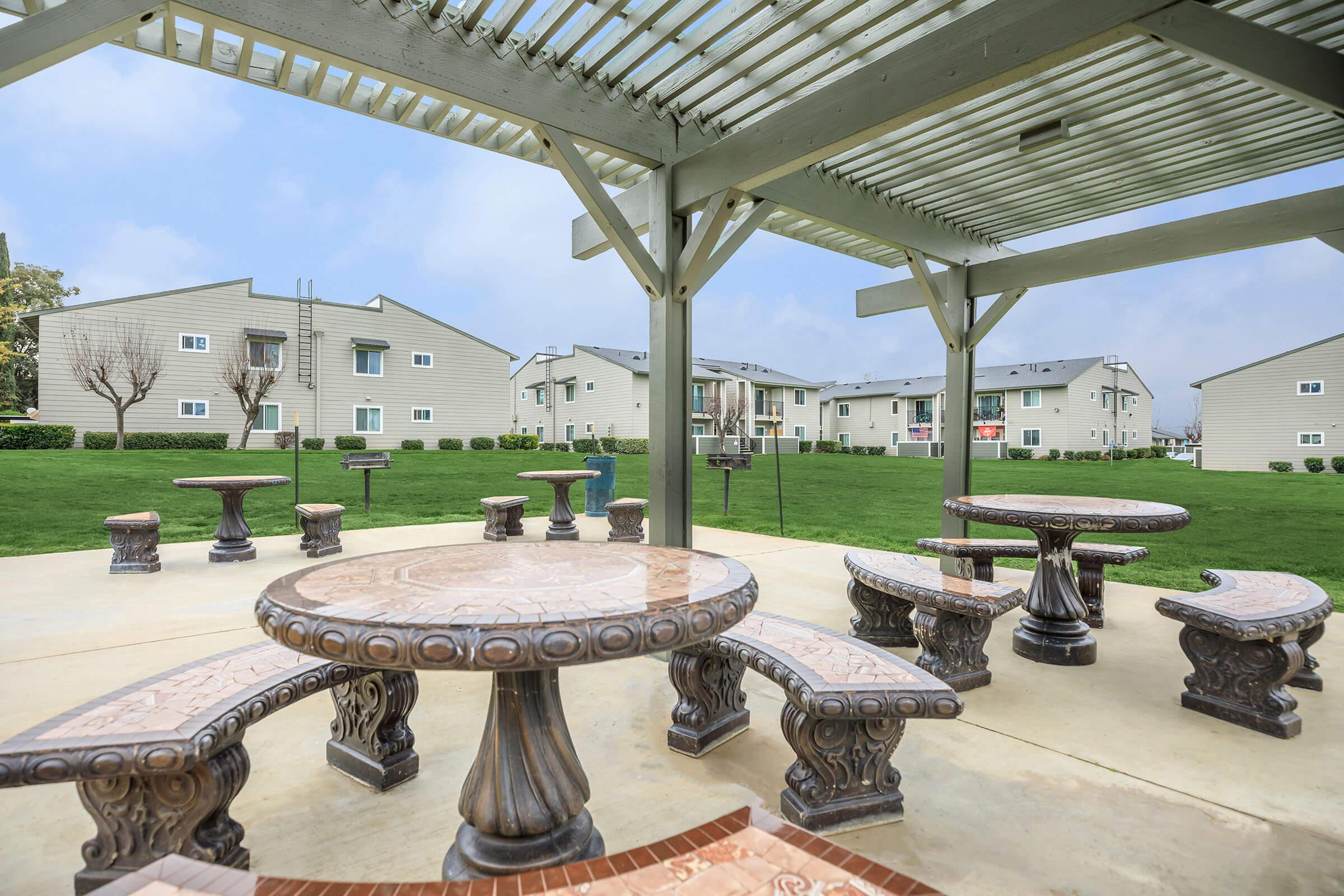 Picnic tables under a pergola