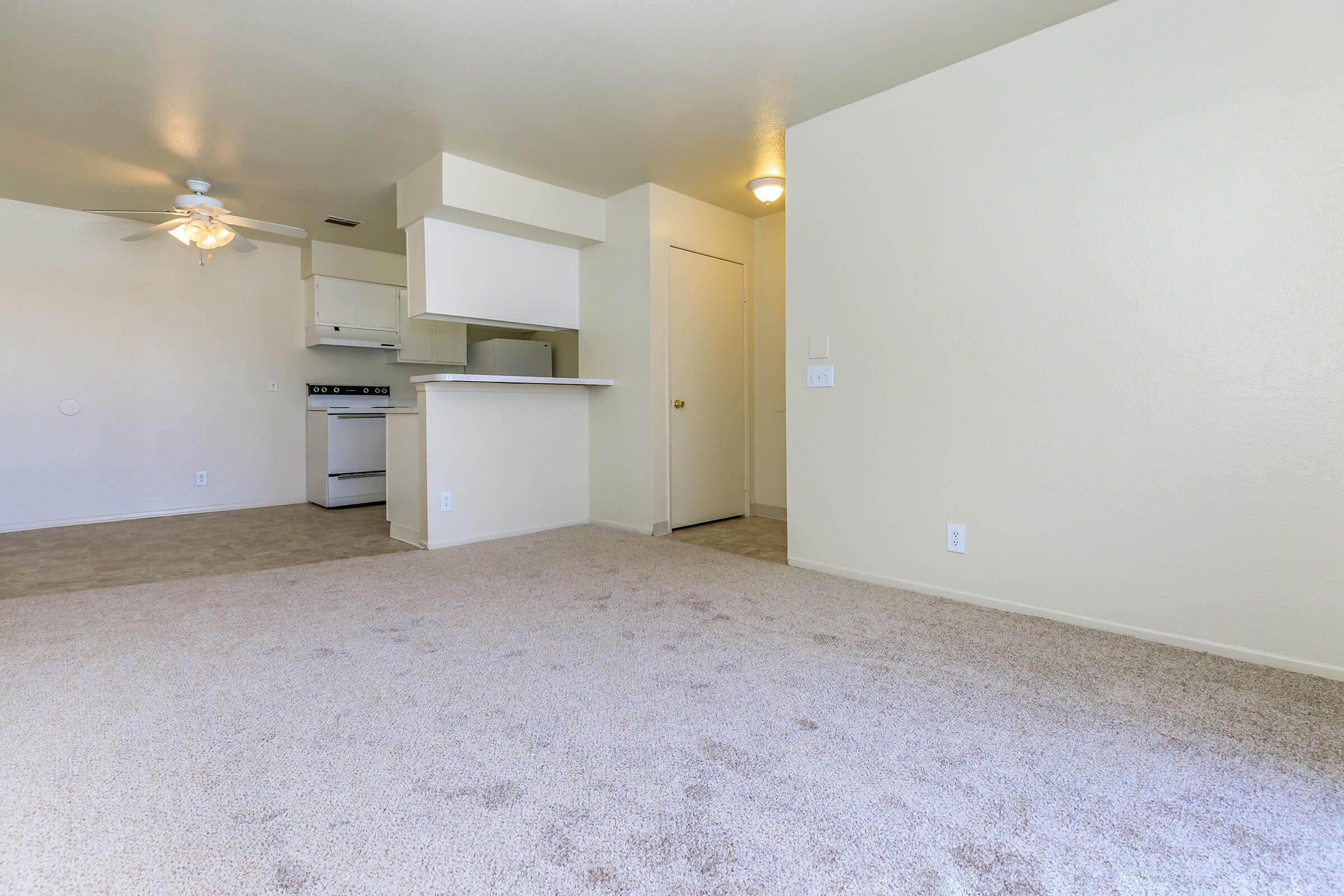 Living room with carpet and dining room with tile