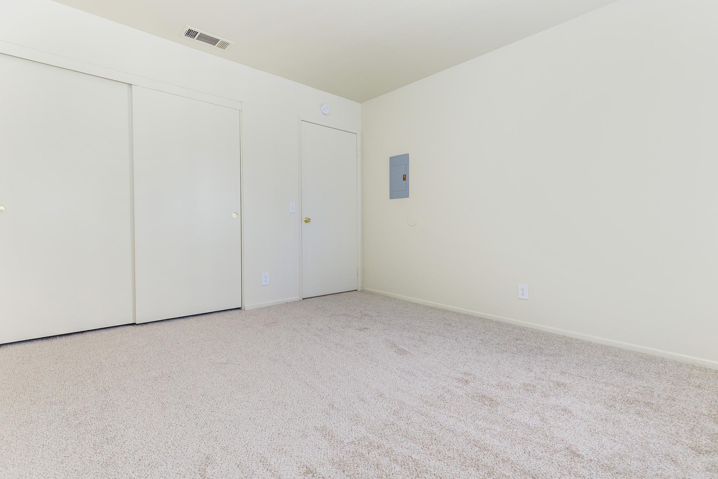 Bedroom with closed sliding closet doors