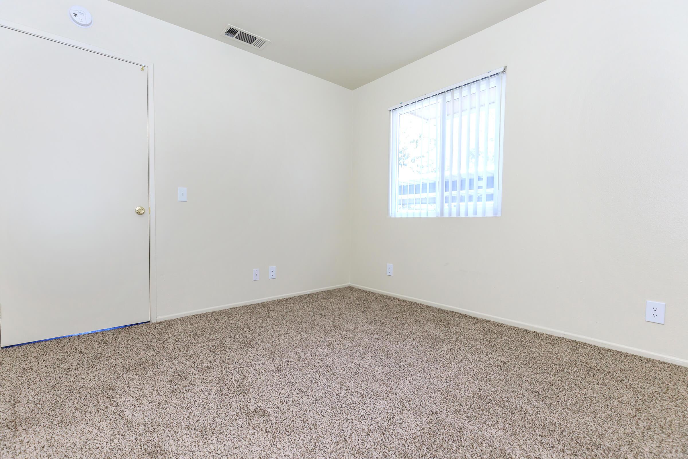 Vacant bedroom with carpet