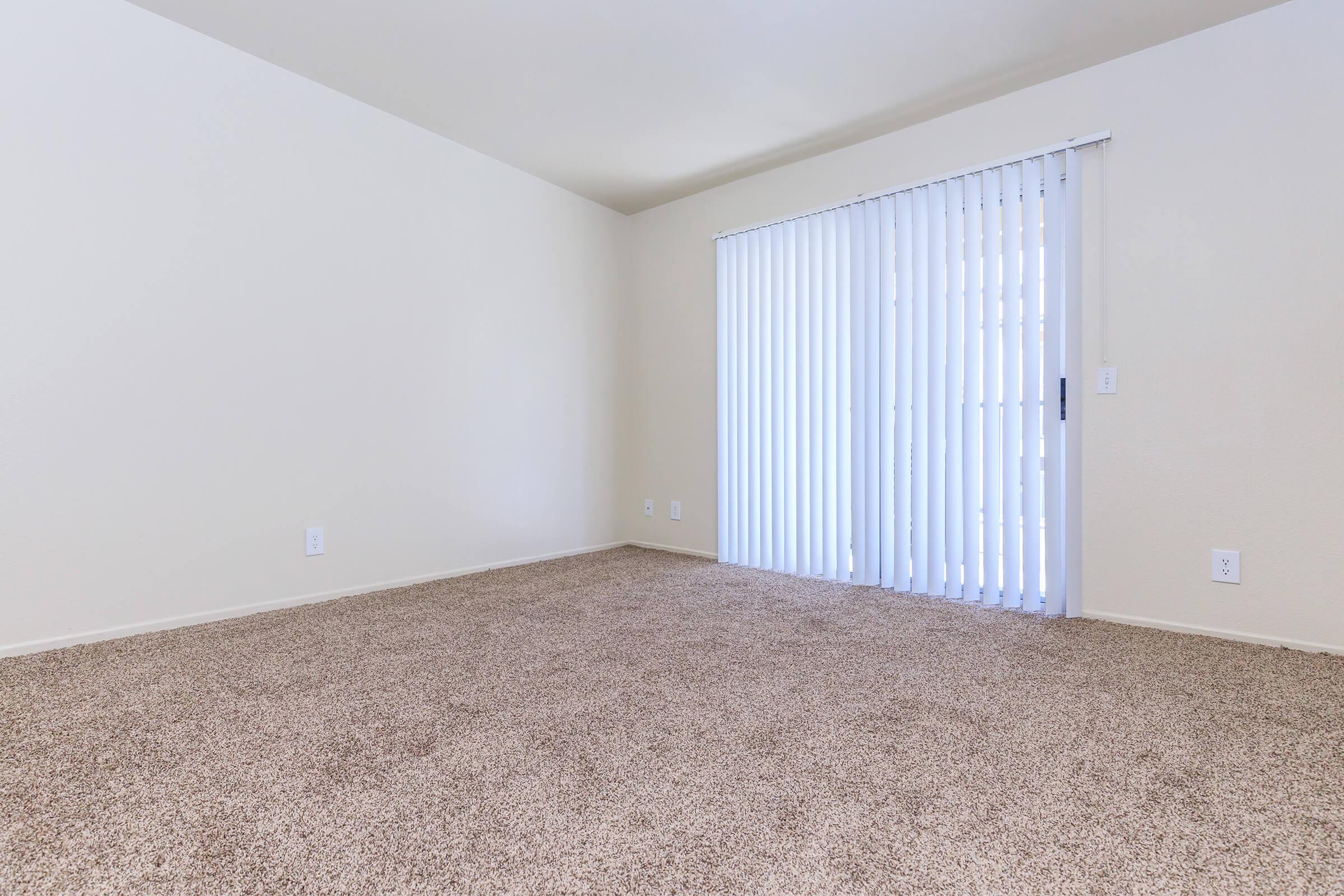 Vacant living room with closed window blinds