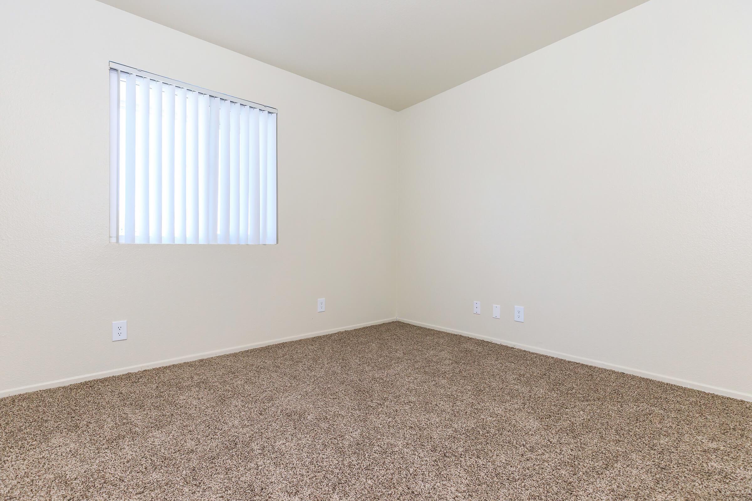 Unfurnished bedroom with carpet