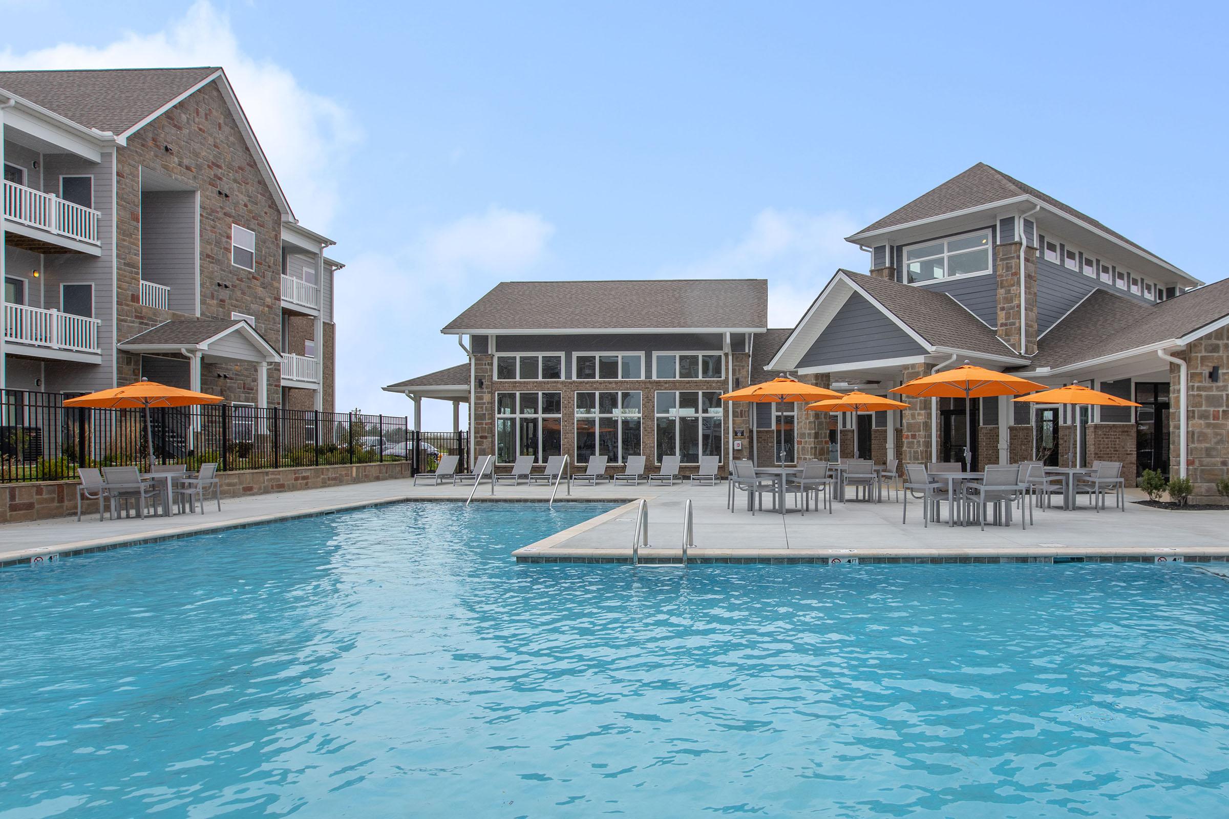 a large pool of water in front of a house