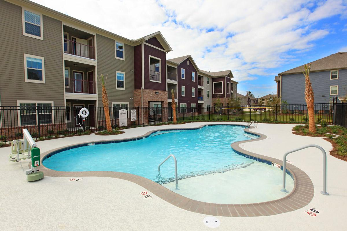 a group of lawn chairs sitting on top of a blue pool of water