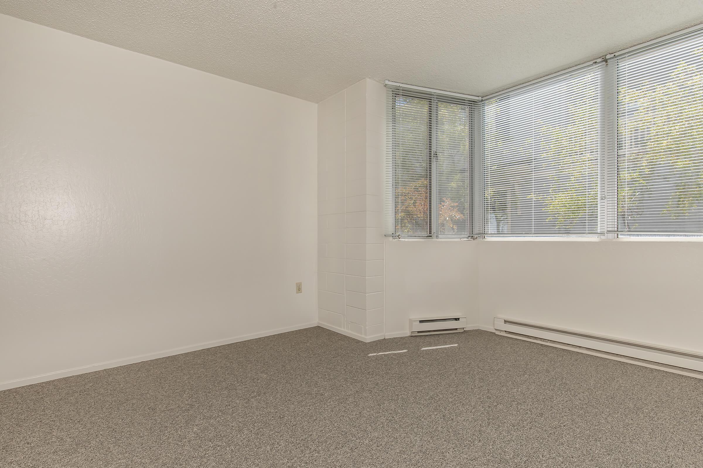 a bedroom with a large window