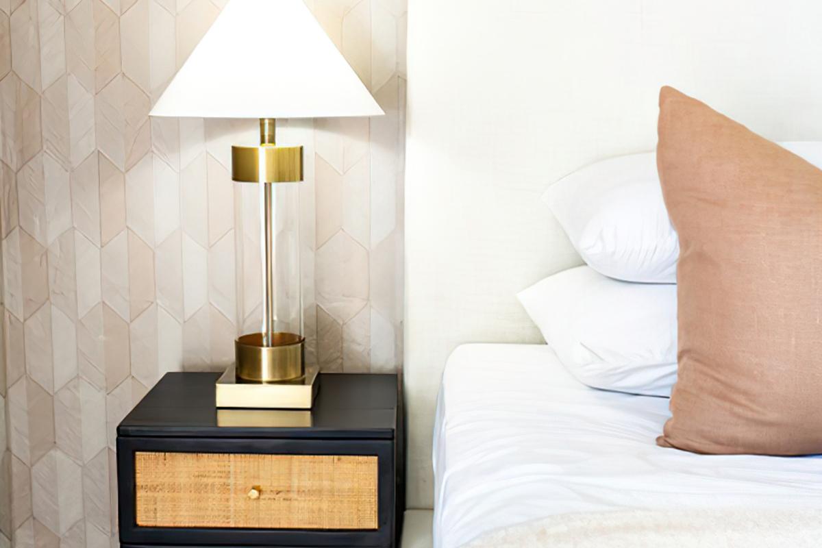 a lamp that is sitting on a bed