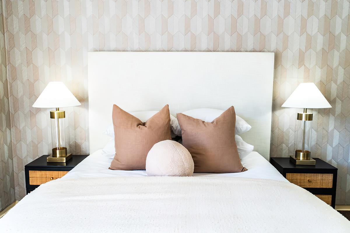 a made bed in a hotel room