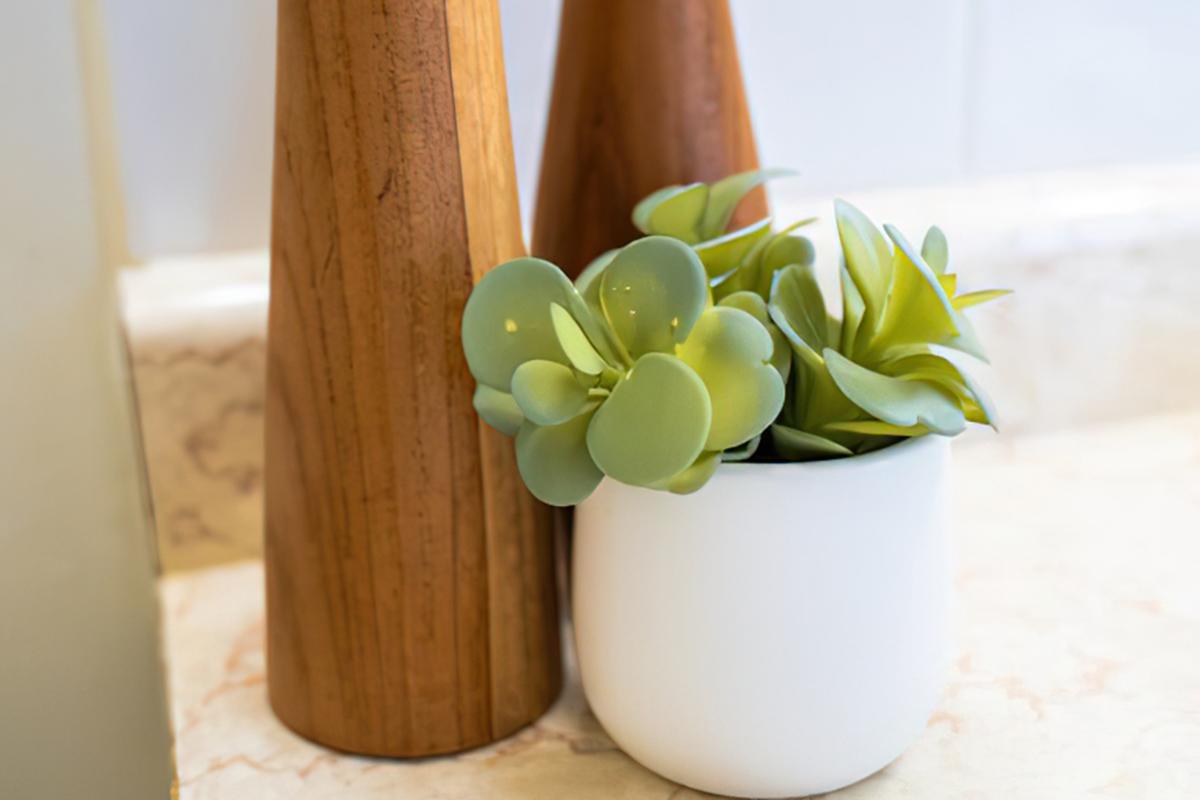 a vase filled with flowers sitting on a table