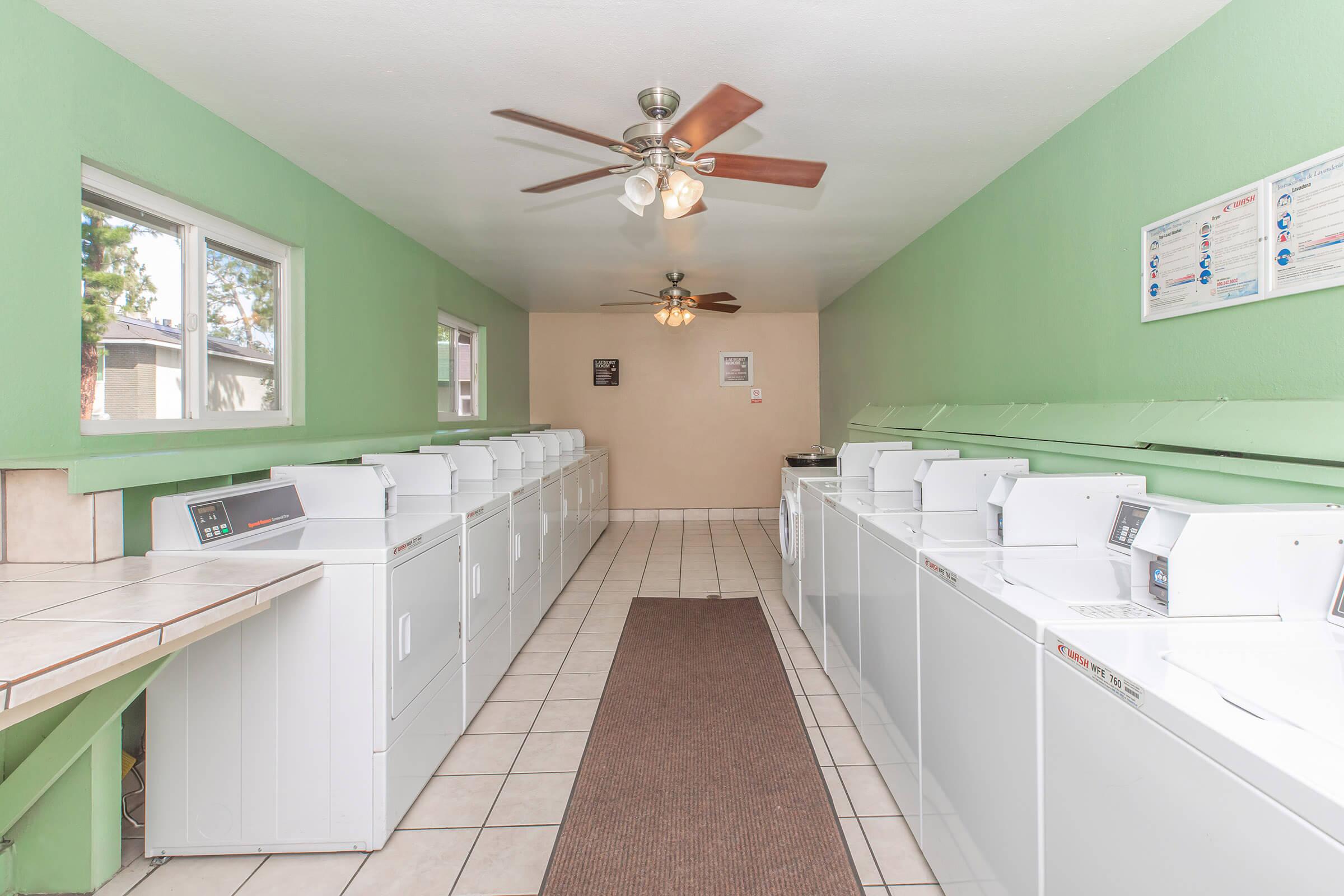 a kitchen with green walls