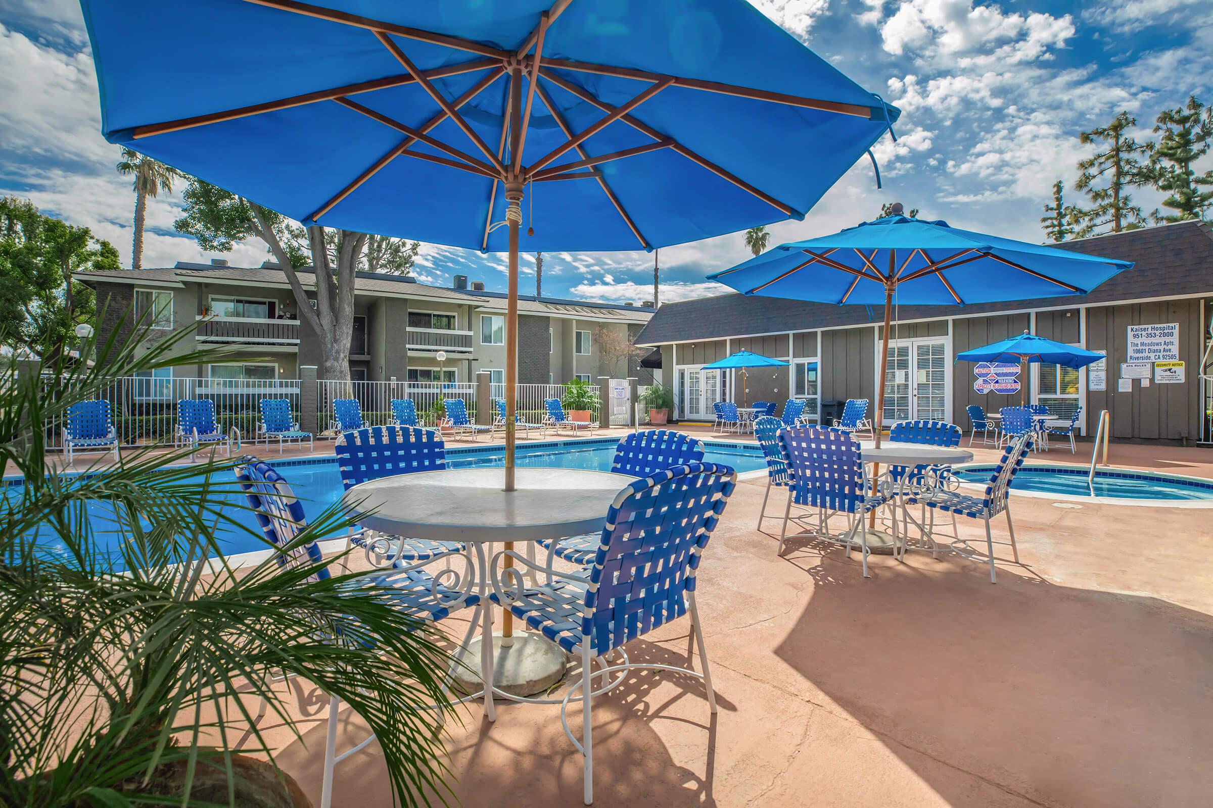 a table topped with a blue umbrella