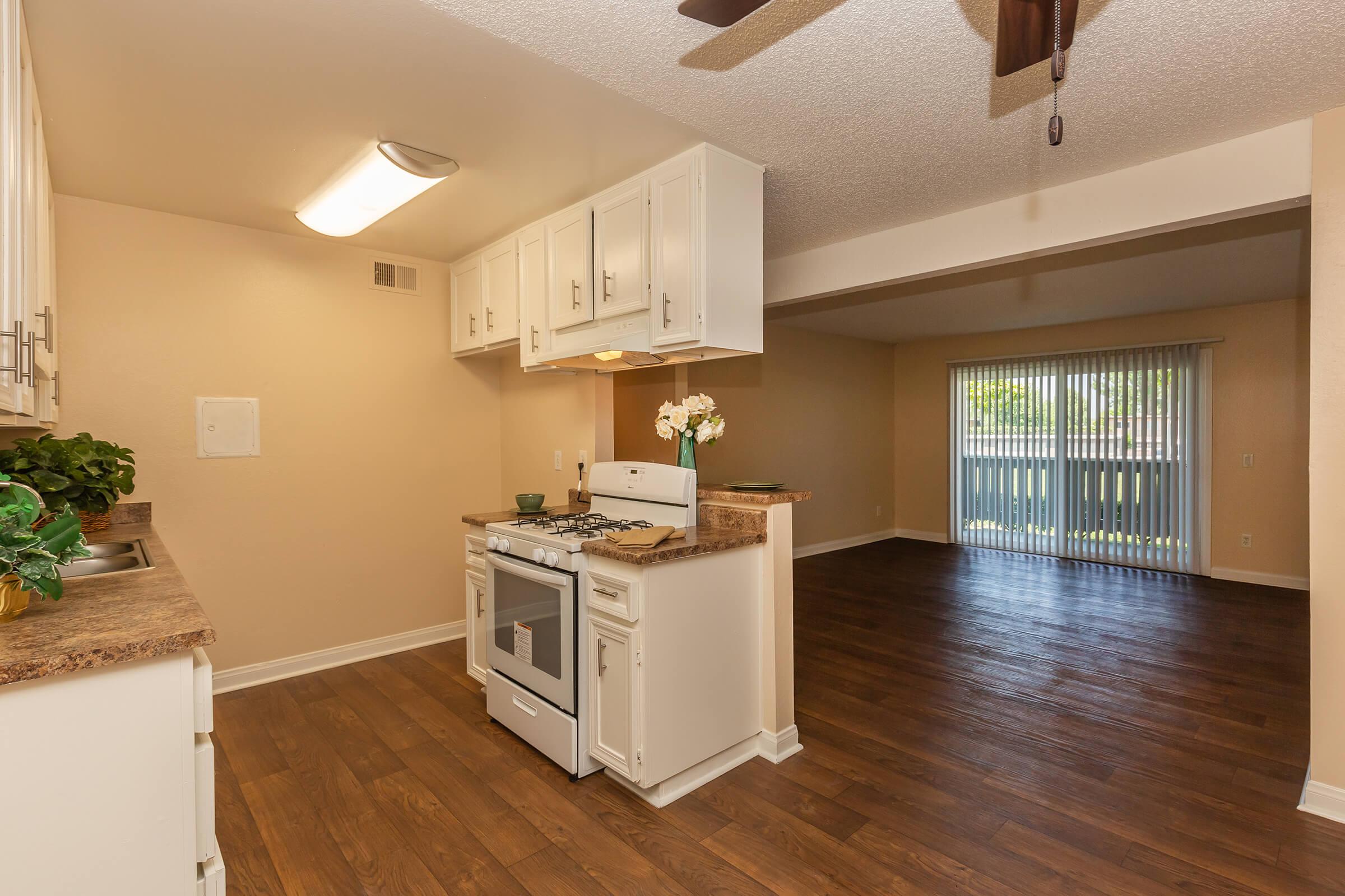 a kitchen with an island in the middle of a room