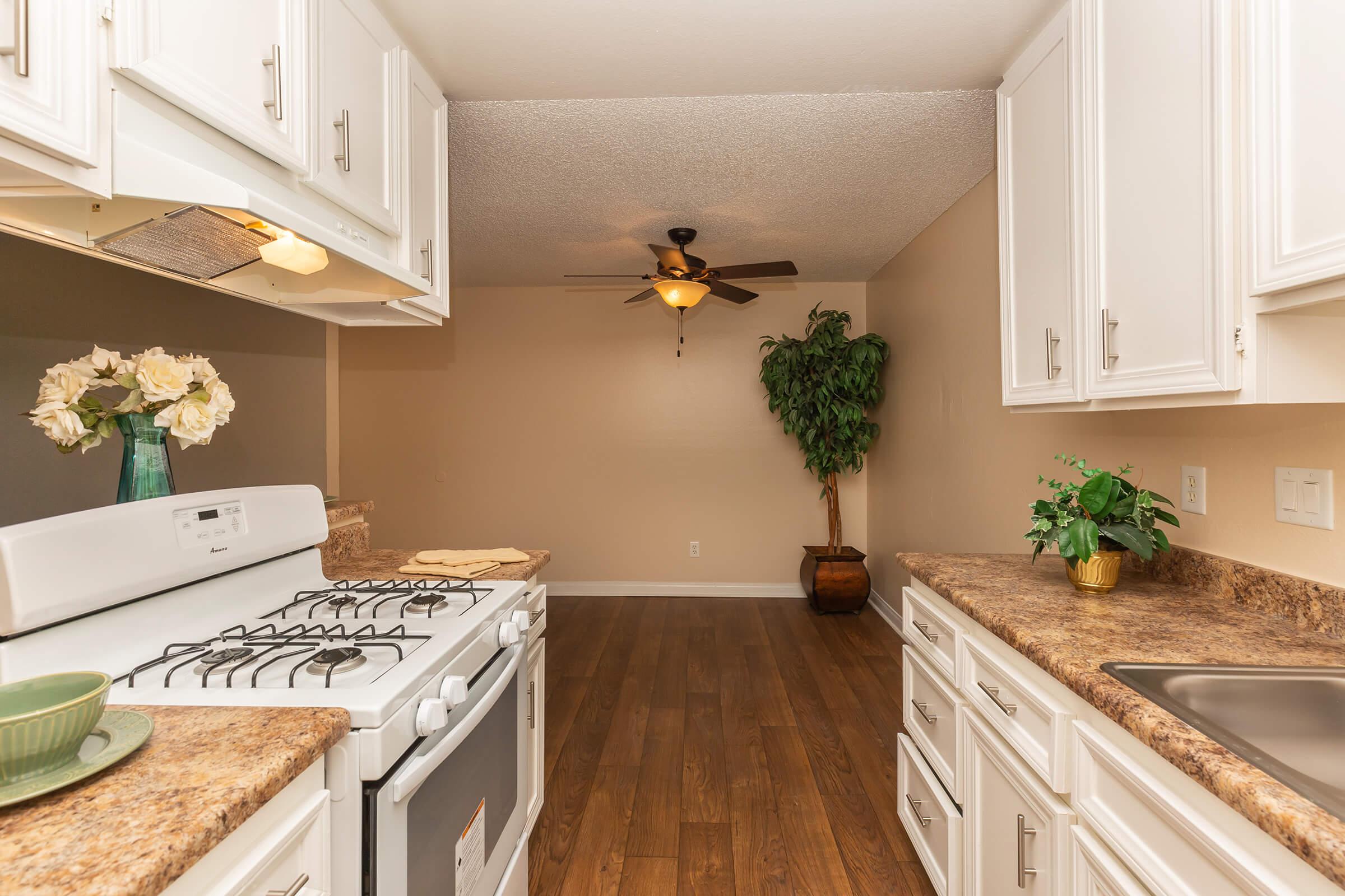 a kitchen with a sink and a microwave