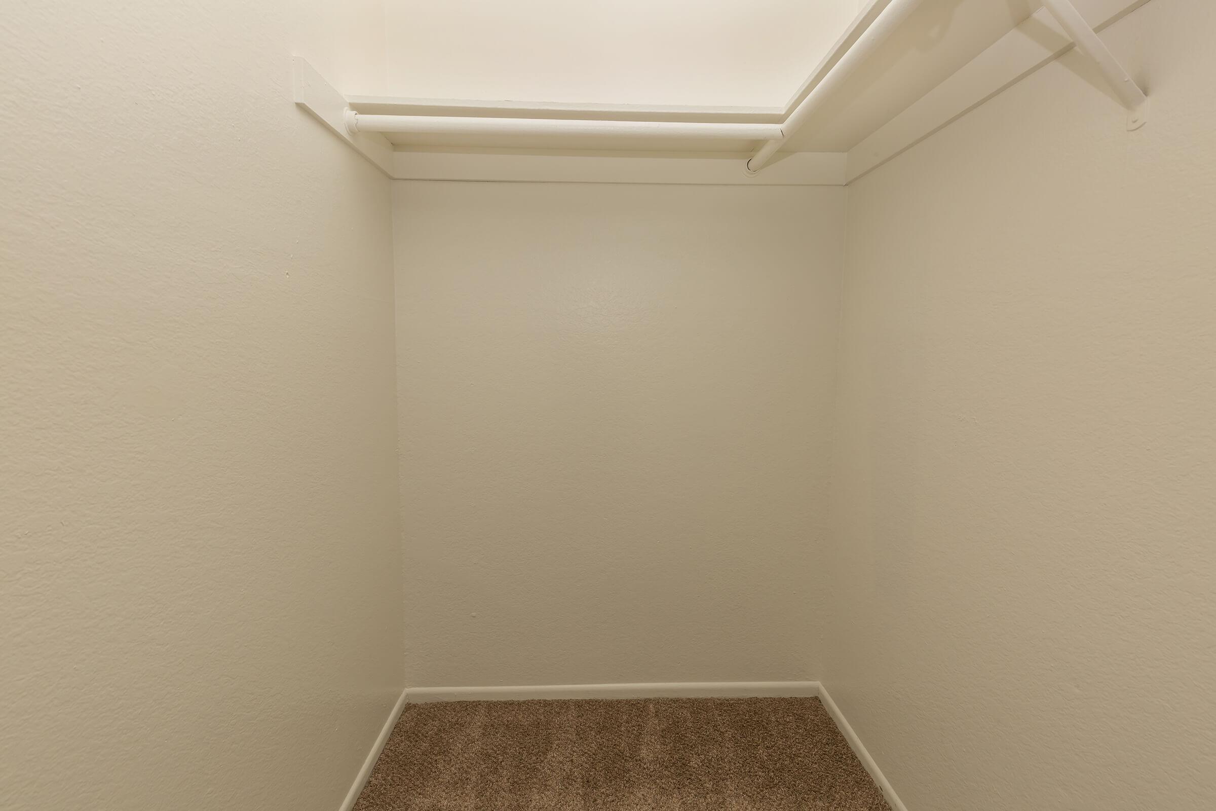 a white sink sitting next to a shower