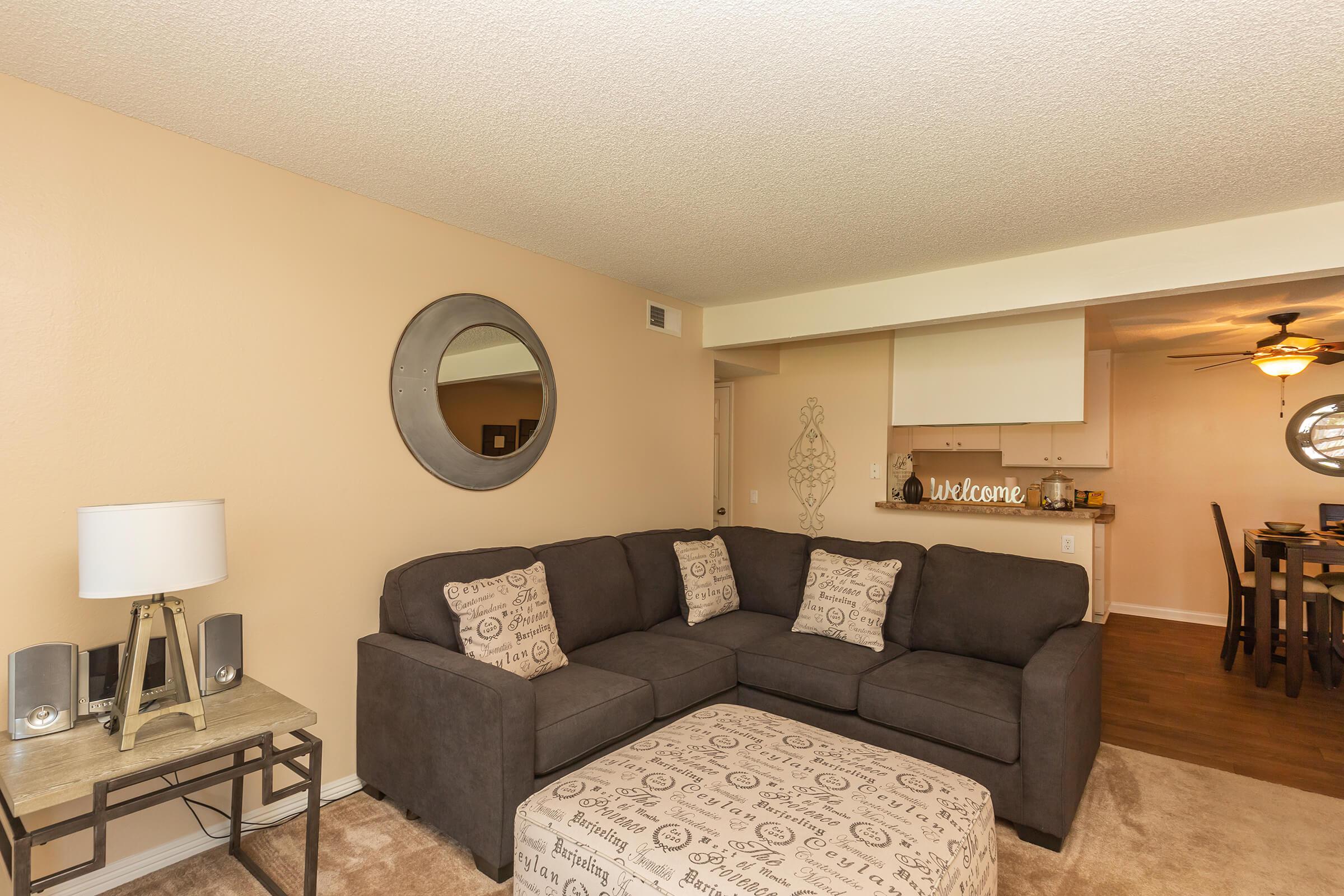 a living room filled with furniture and a table