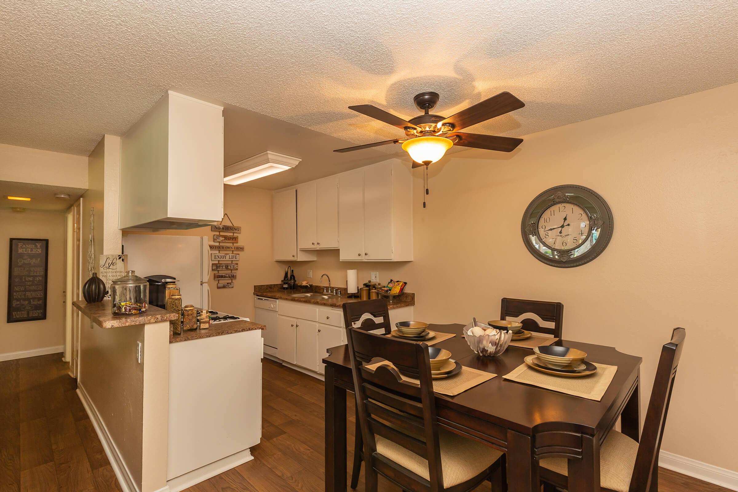 a kitchen with a table in a room