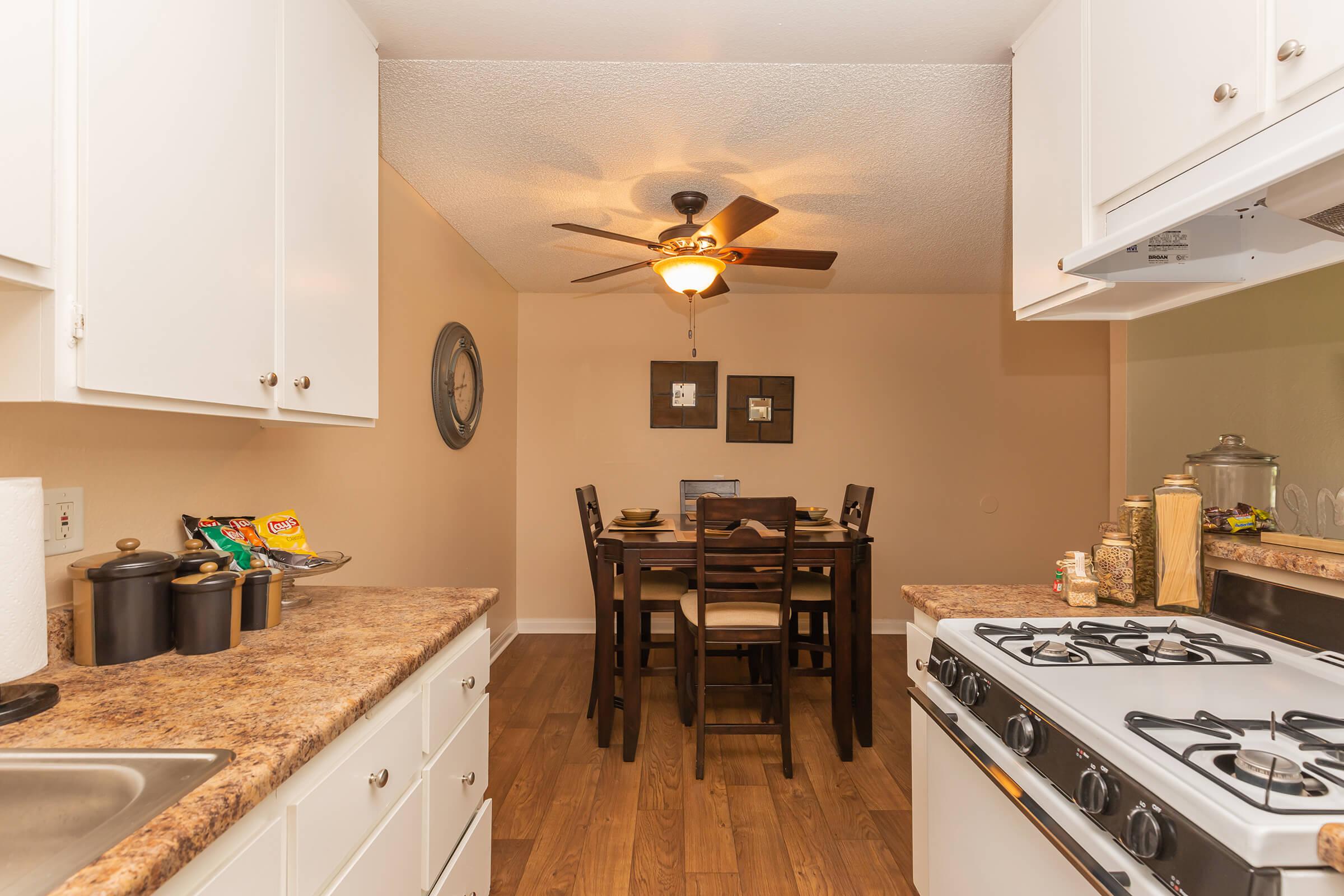 a kitchen with a table in a room