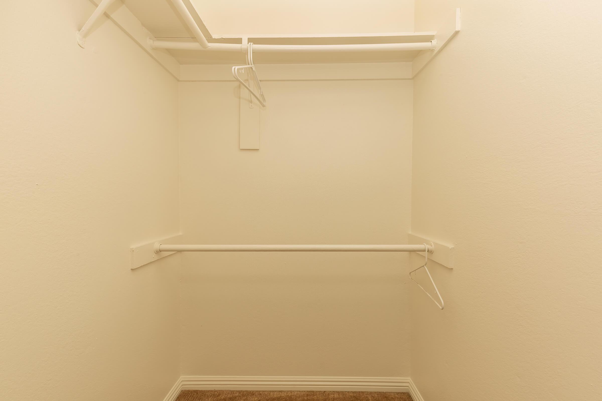 a white sink sitting next to a shower