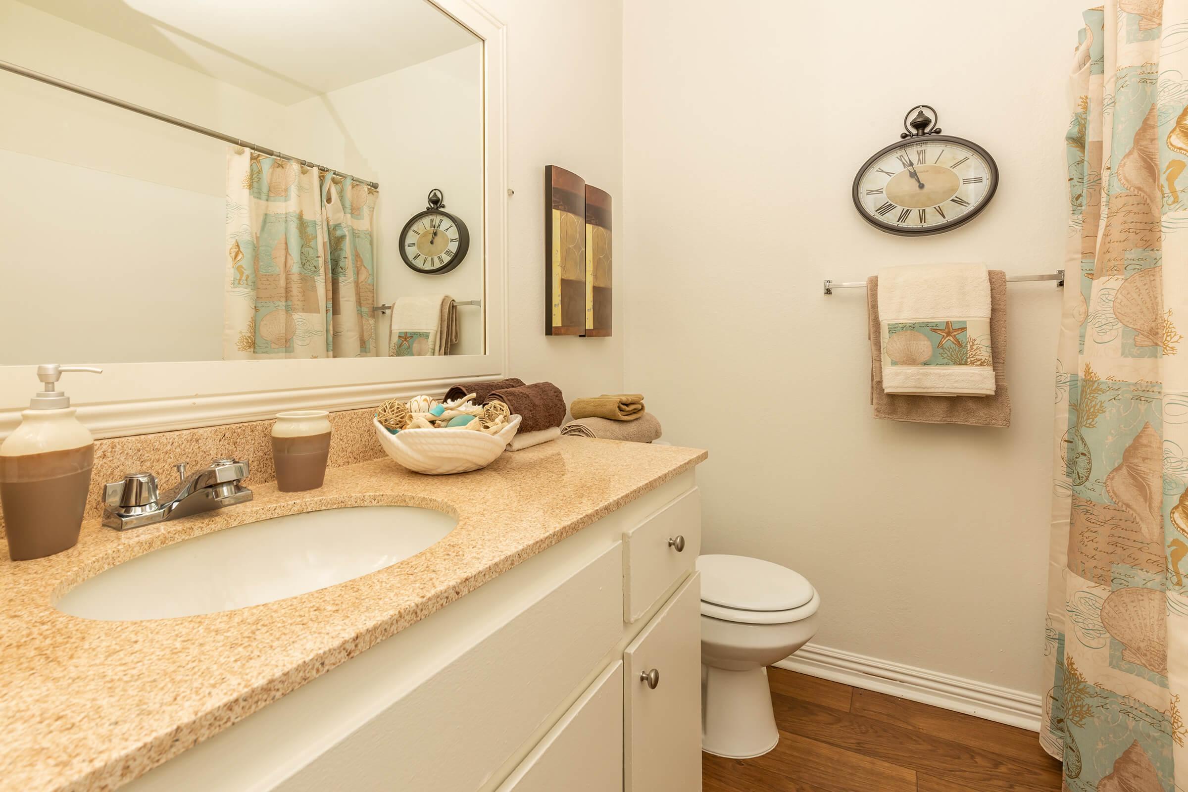 a room with a sink and a mirror