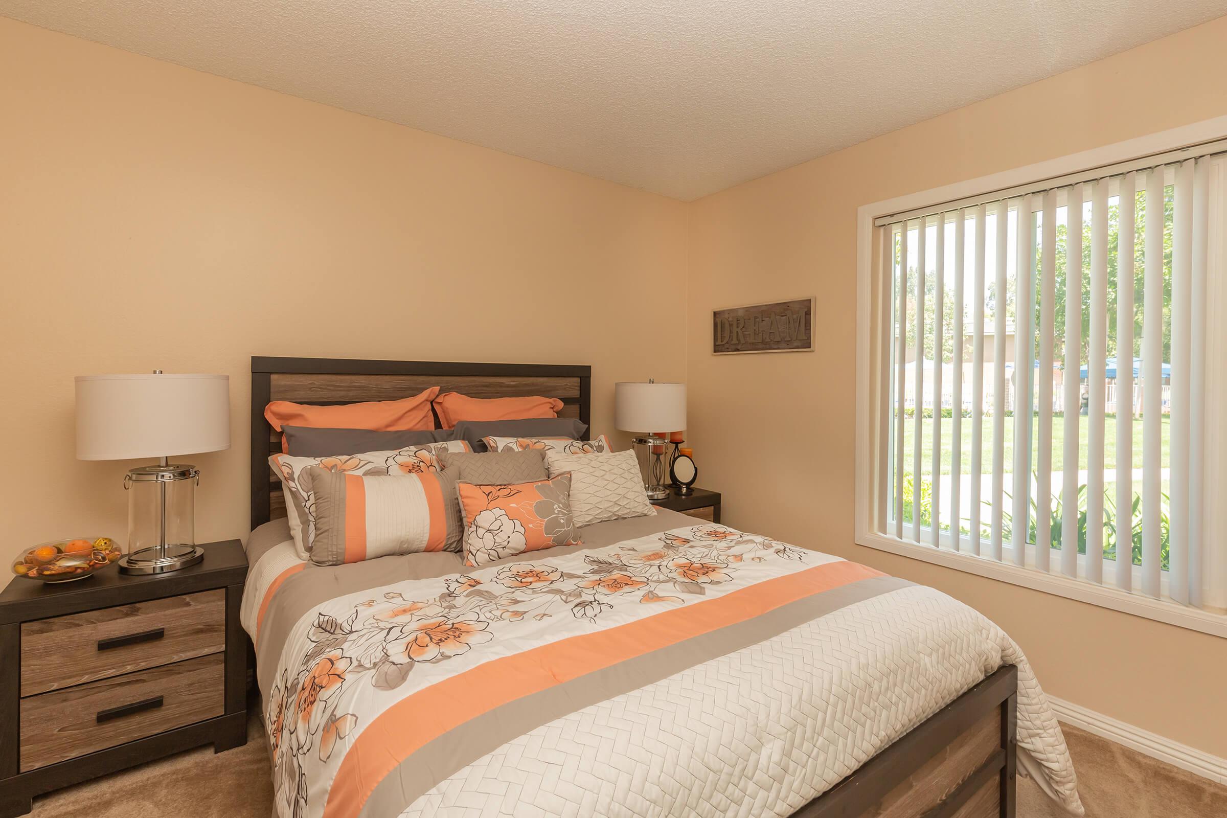 a bedroom with a bed in a hotel room