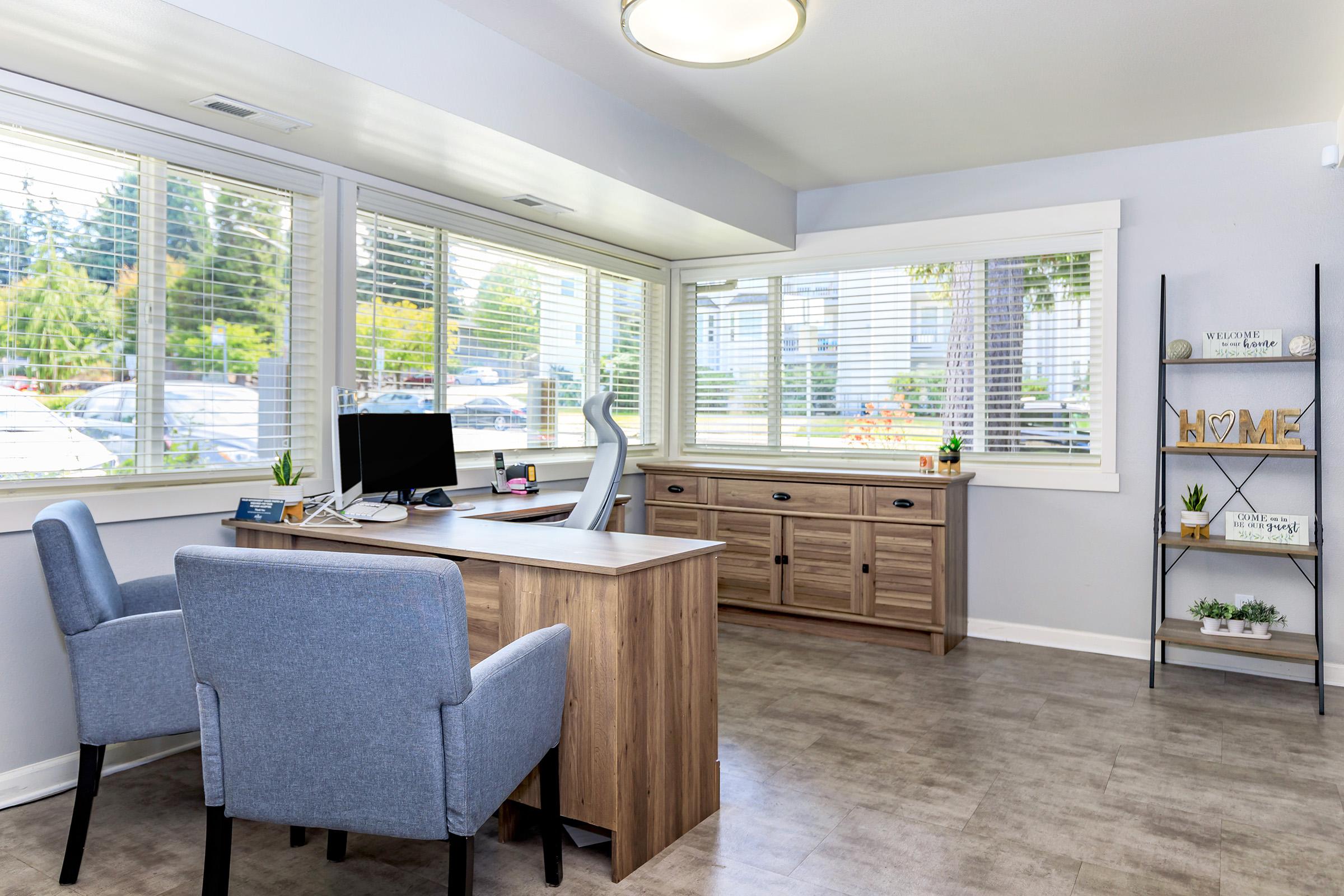 a room filled with furniture and a large window