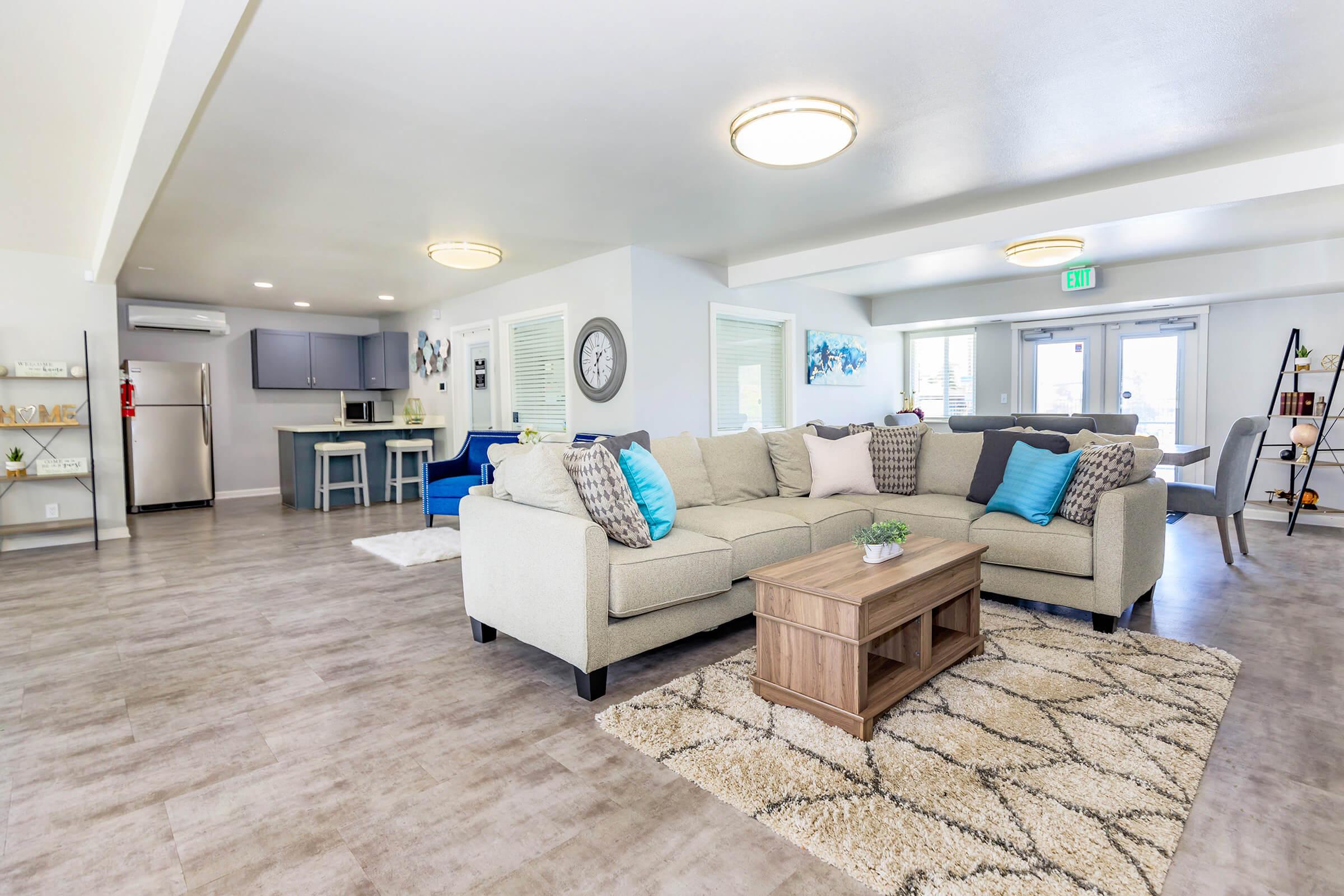 a living room filled with furniture and a tv