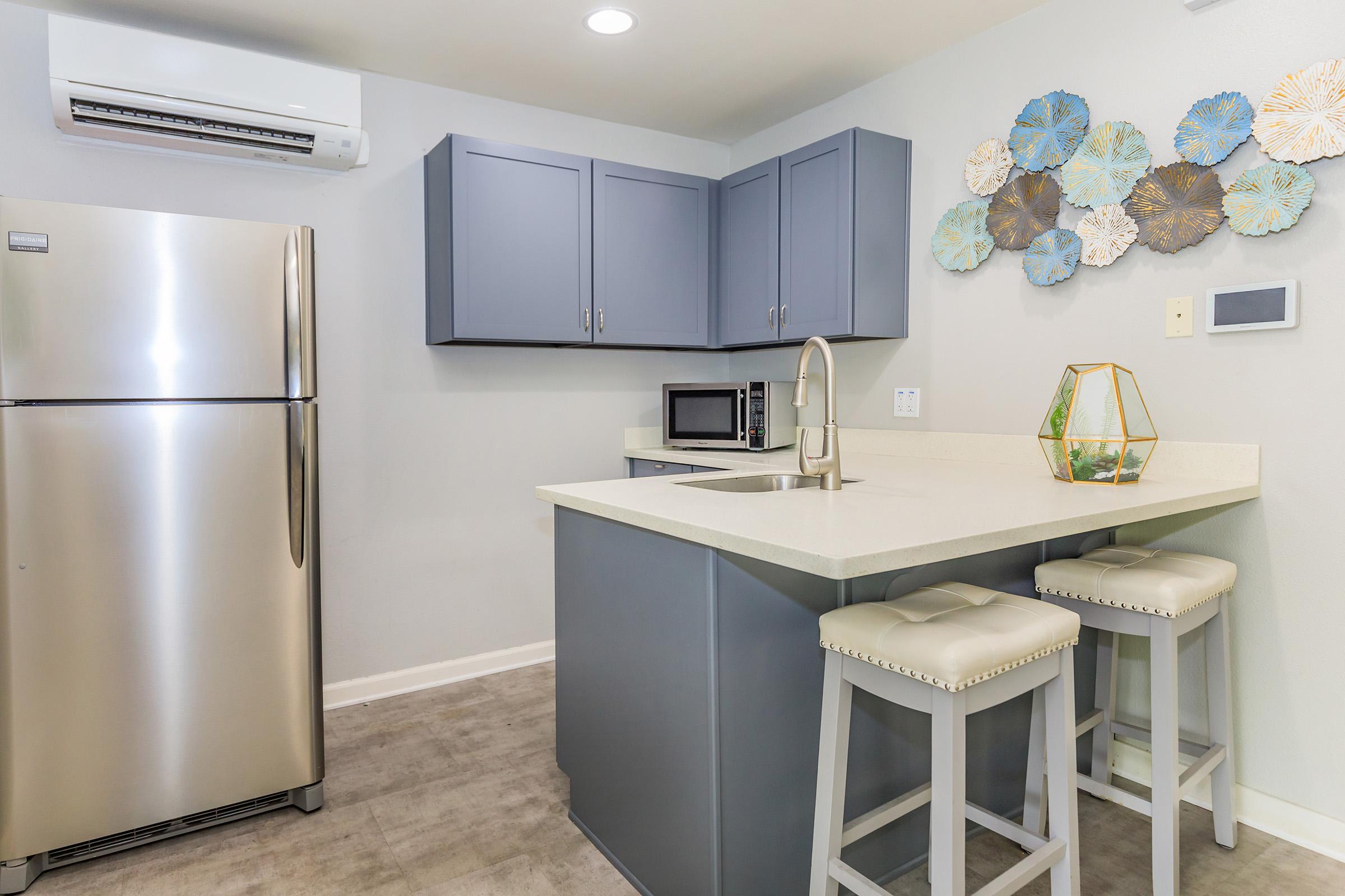 a stainless steel refrigerator in a kitchen