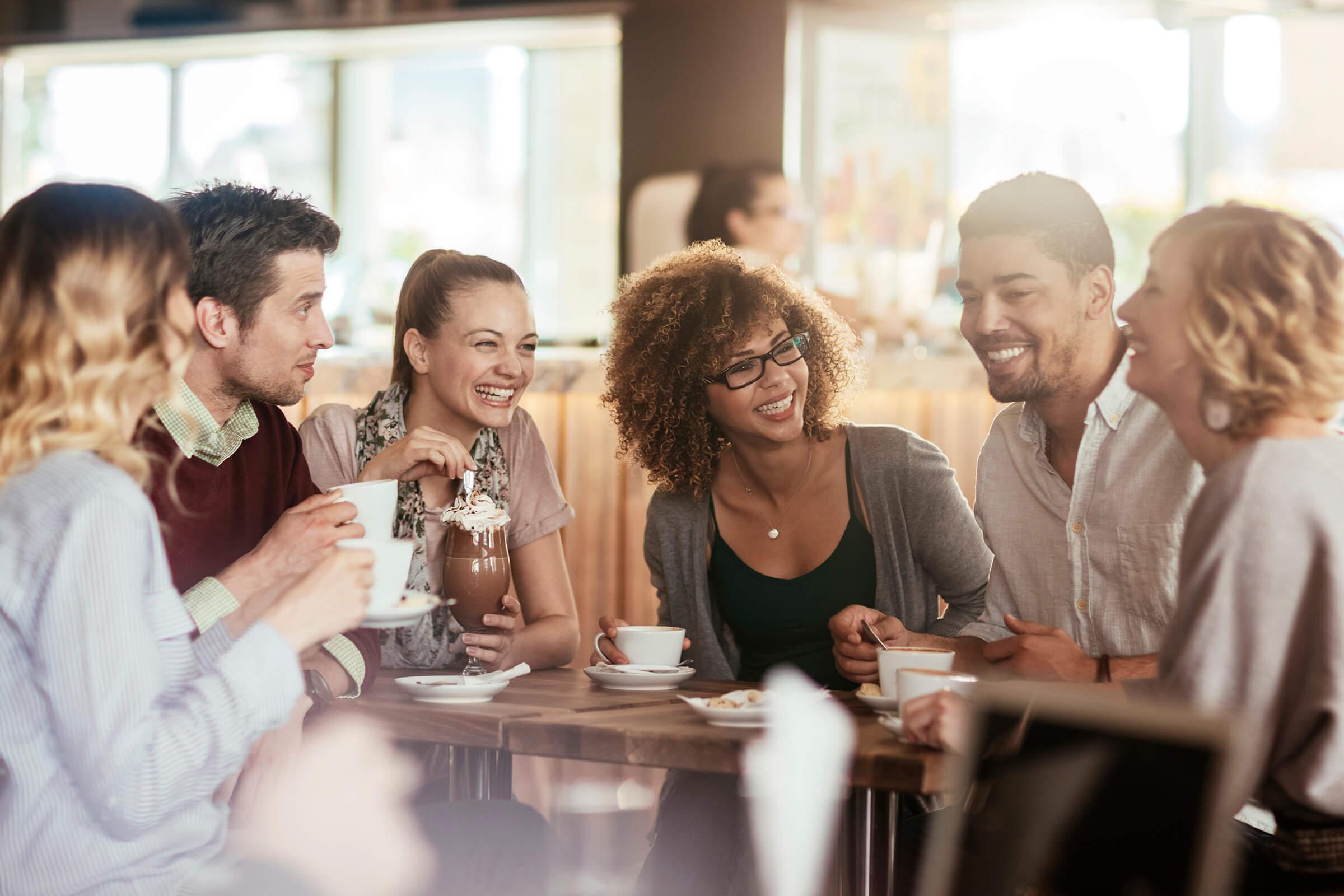 a group of people sitting at a table