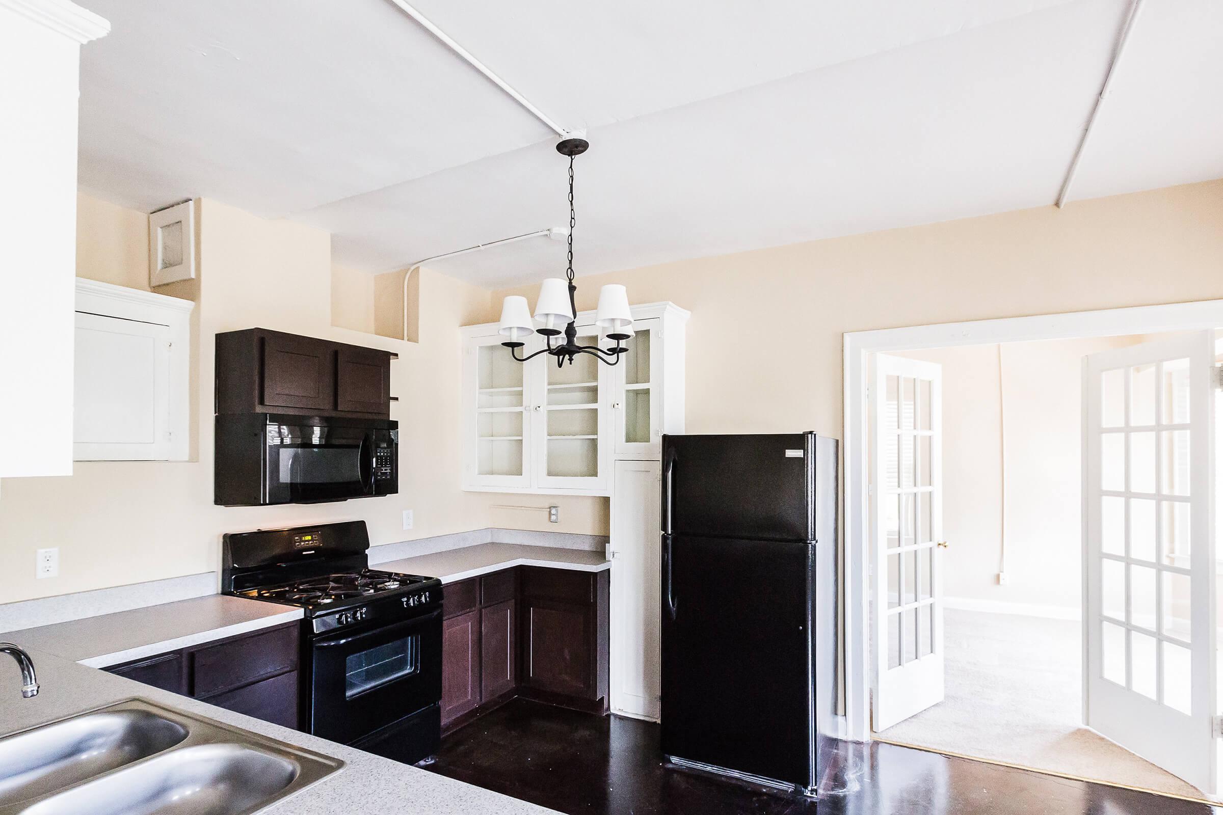a large kitchen with stainless steel appliances