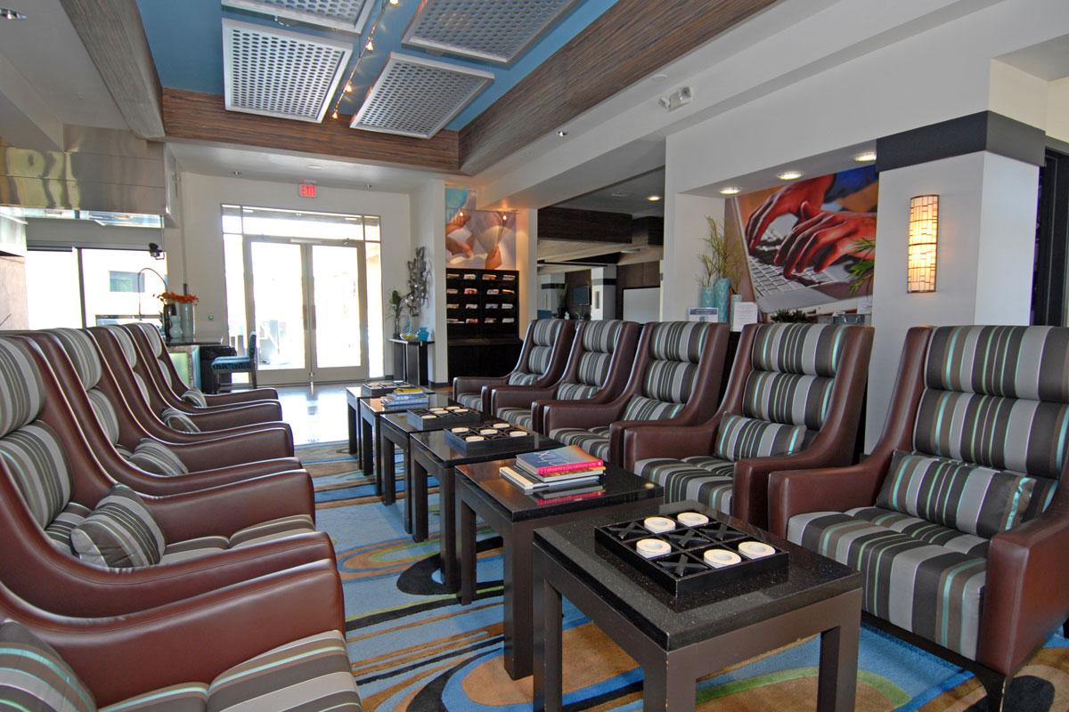 a living room filled with furniture and a large window