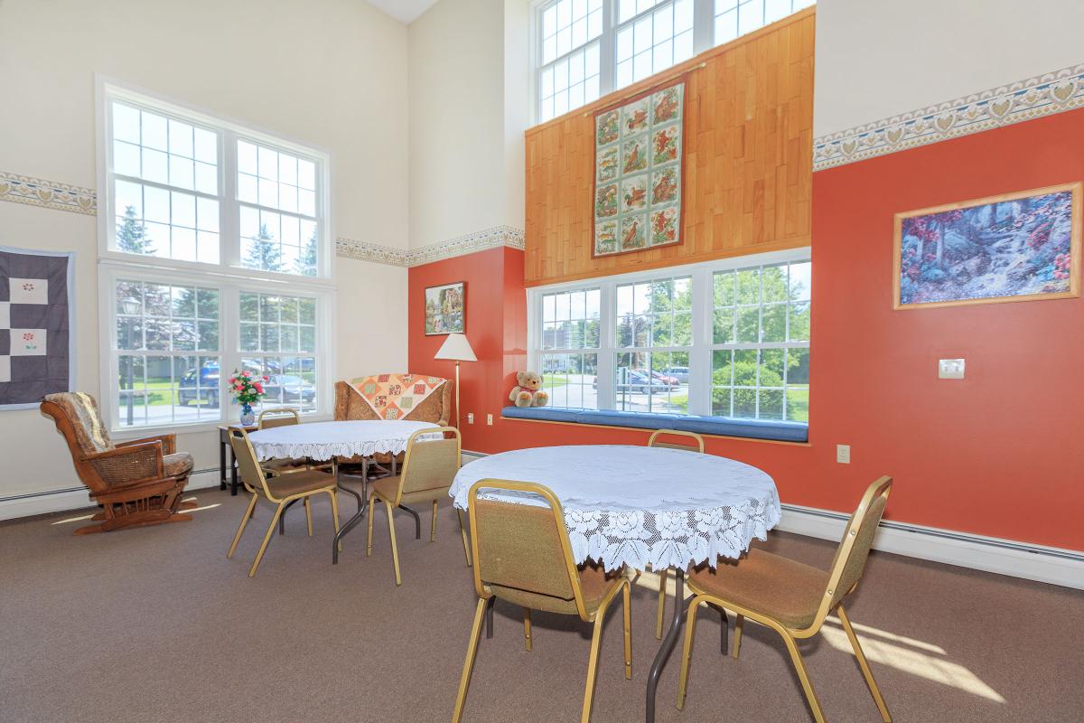 a dining room table in front of a window