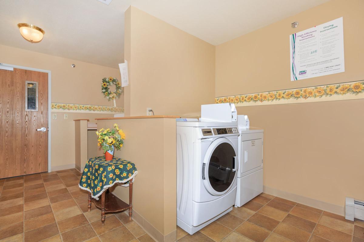 a large white refrigerator in a kitchen