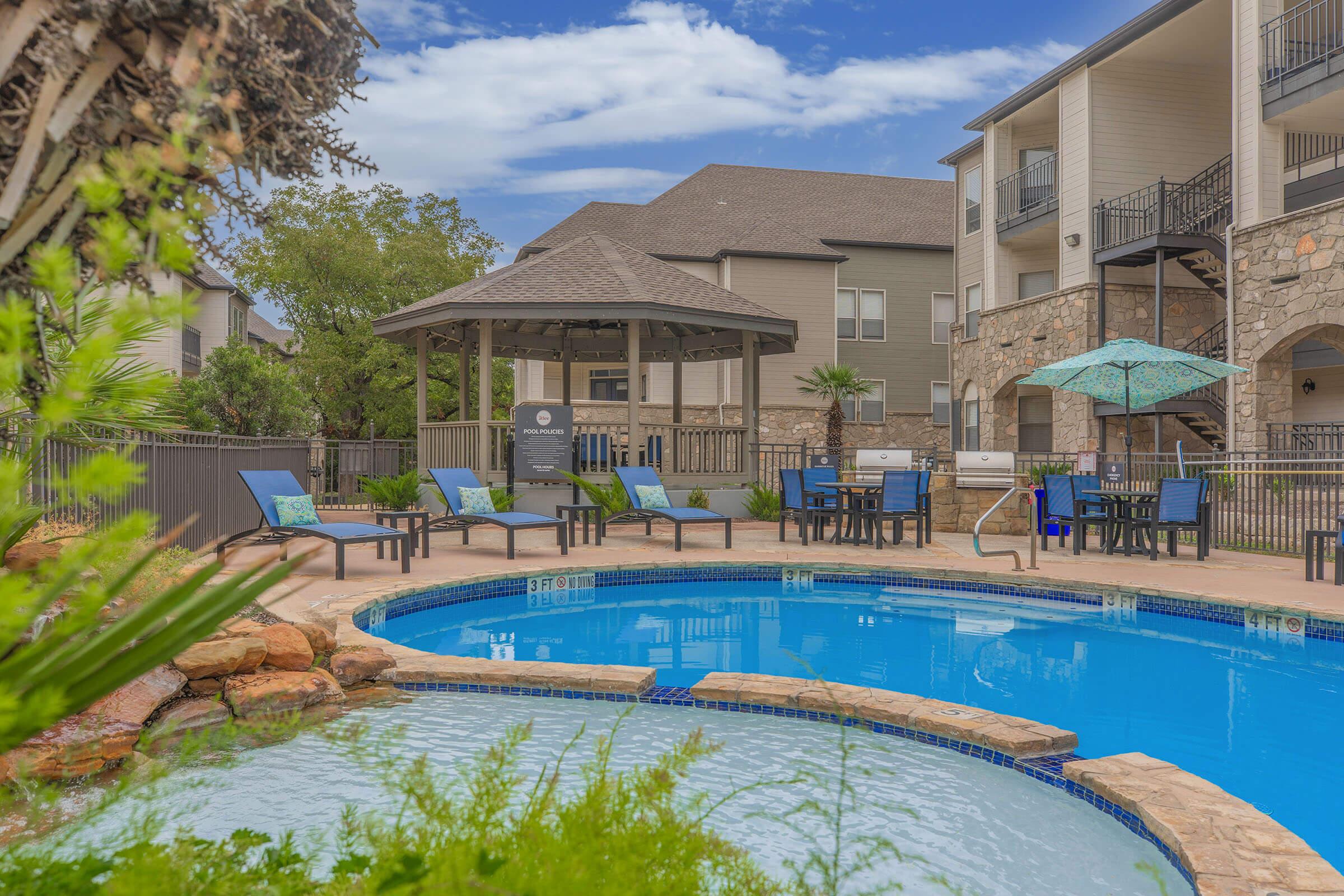 a large pool of water in front of a house