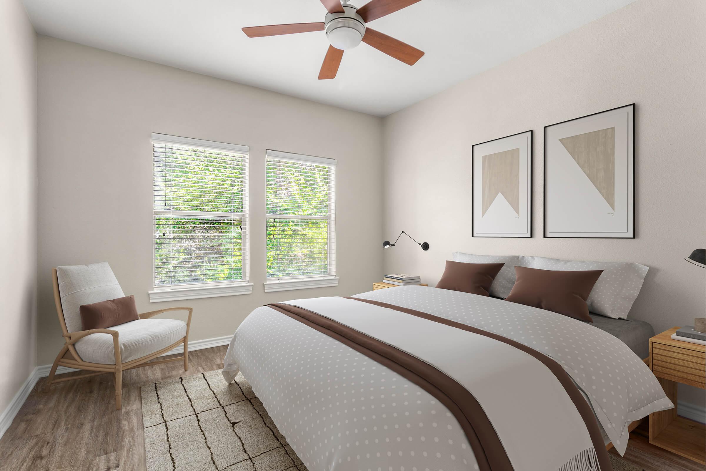 a bedroom with a bed and desk in a room