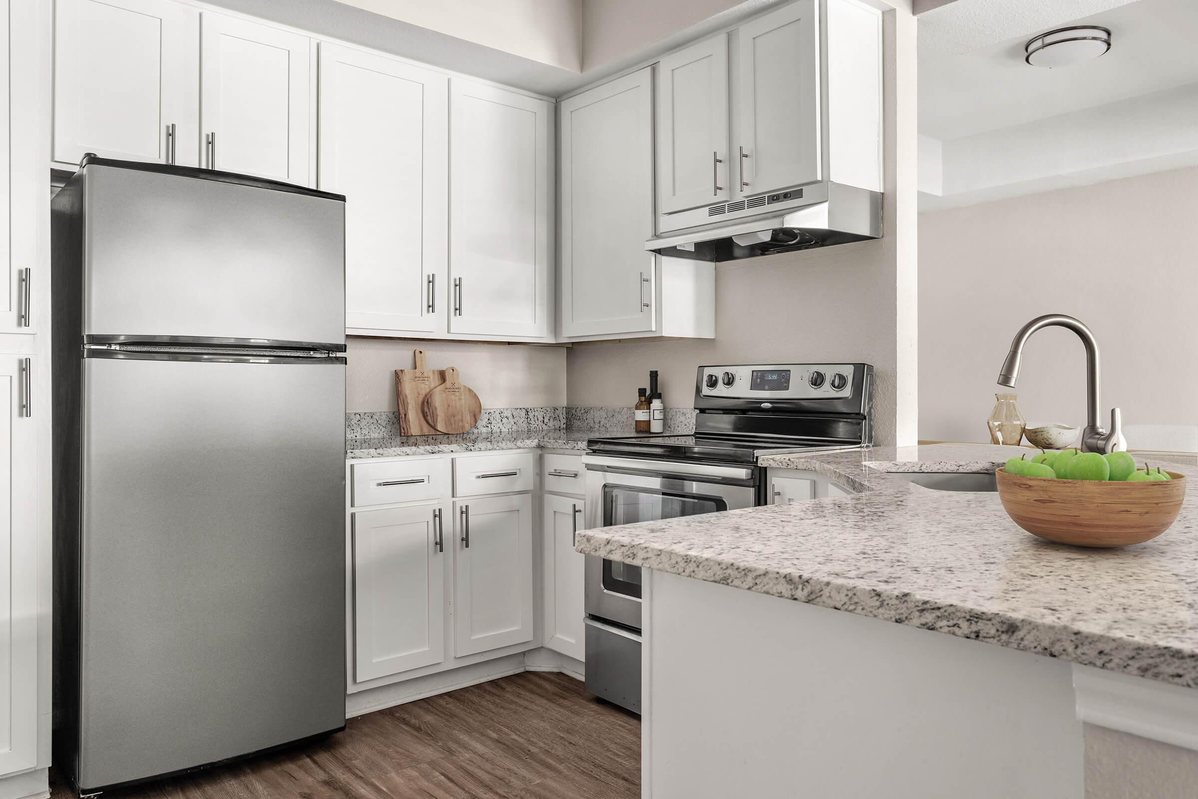 a kitchen with a stove and a sink