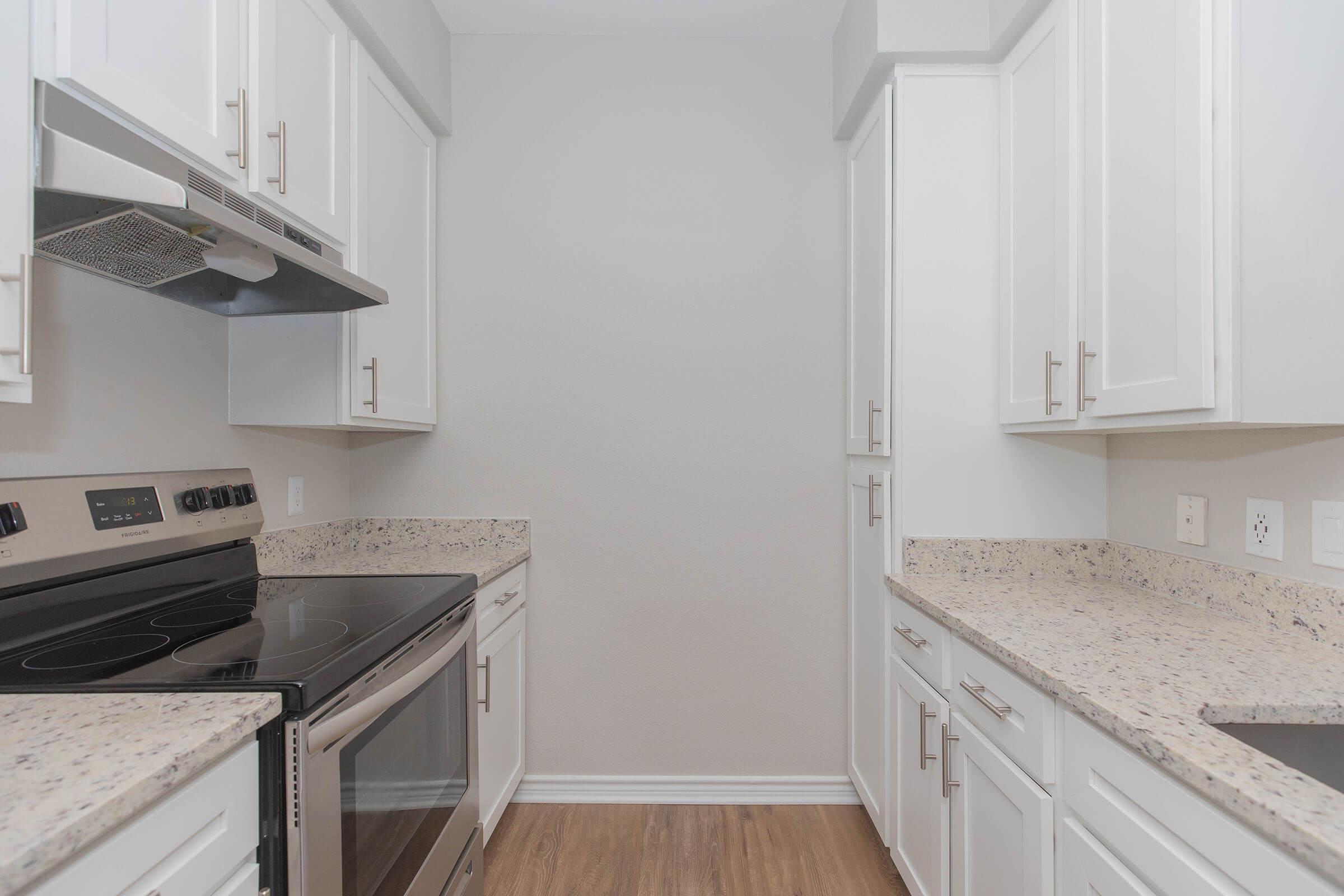 a kitchen with a stove top oven