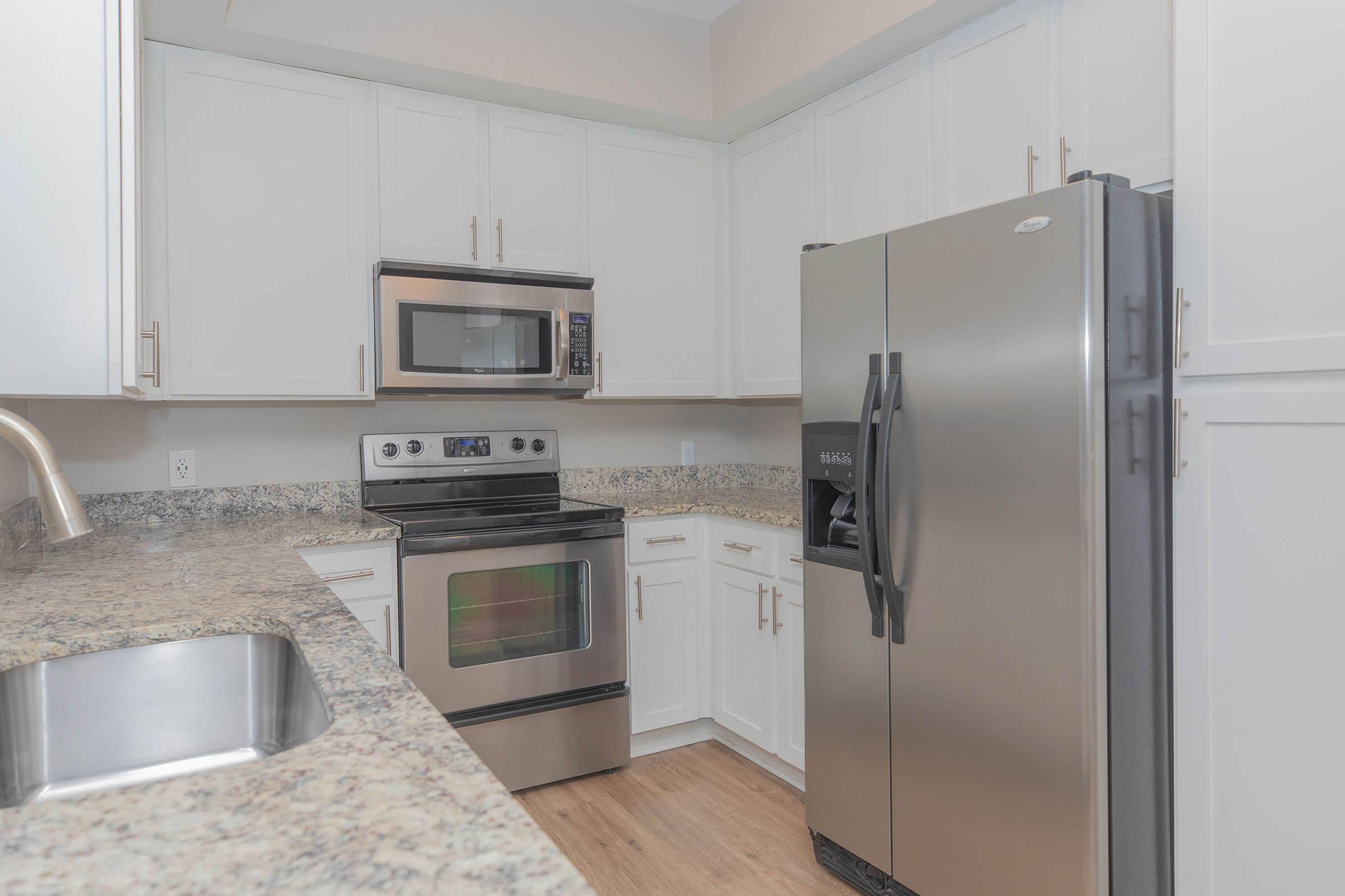 a stainless steel refrigerator in a kitchen